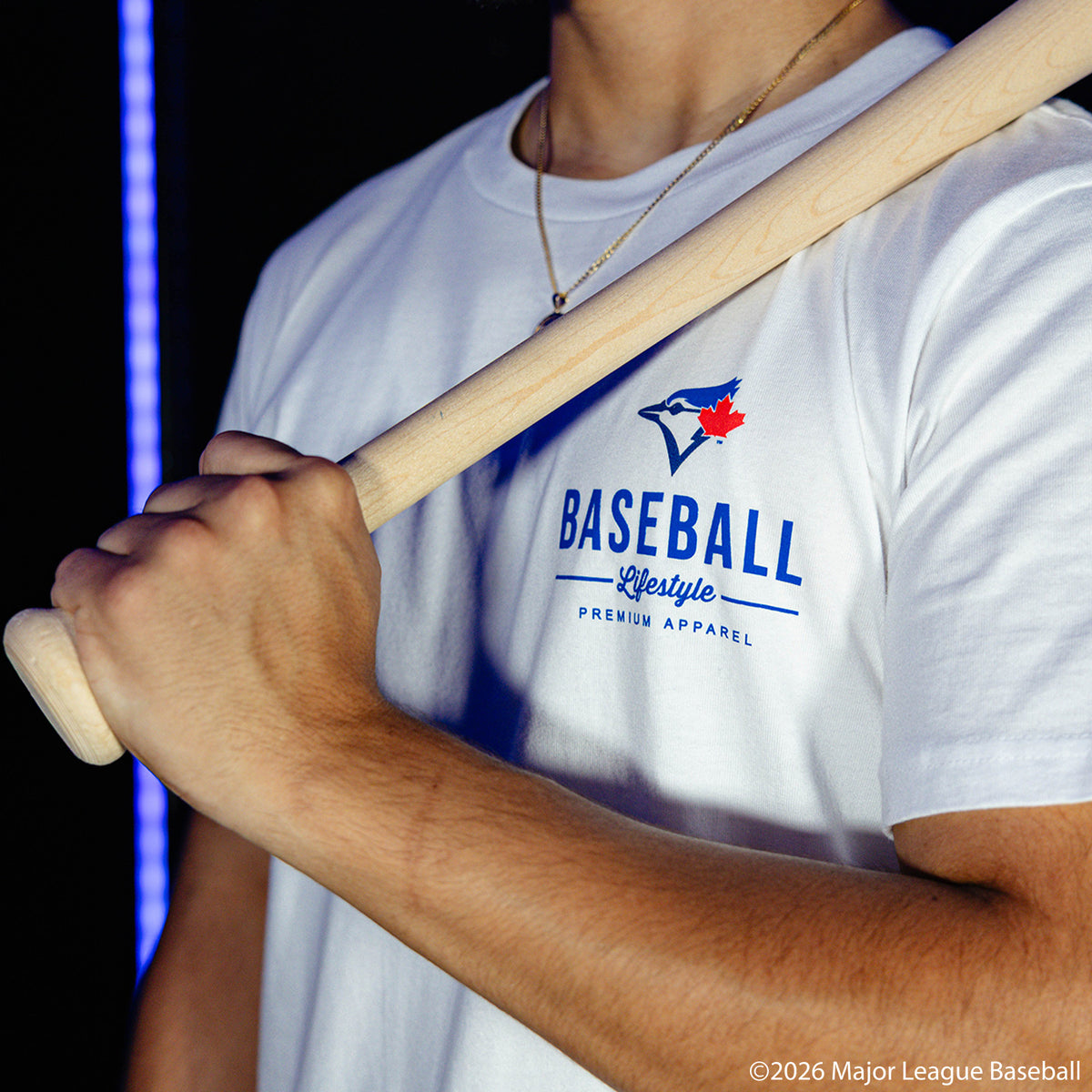 Adult model wearing white graphic tee with "Toronto Blue Jays Ice Cream" design