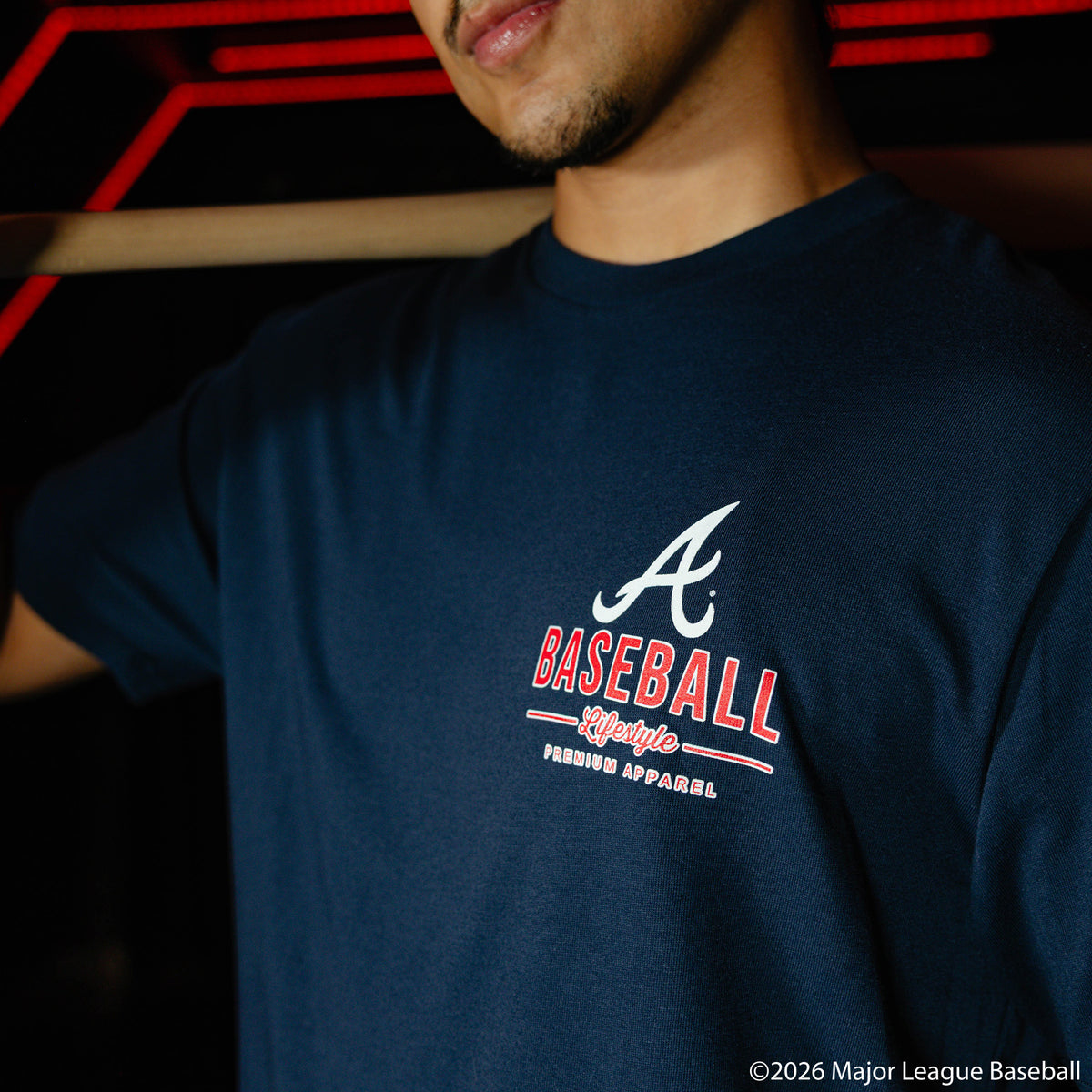 Adult model wearing navy graphic tee with "Atlanta Braves Ice Cream" design