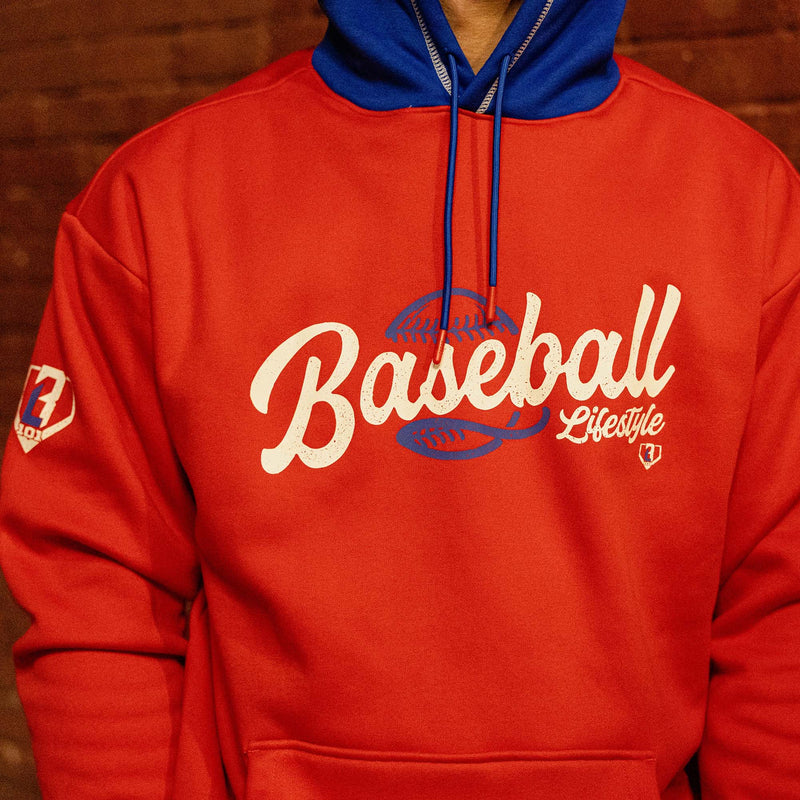 Close up of red Baseball Lifestyle hoodie chest graphic with blue baseball lace detail and BL101 sleeve logo