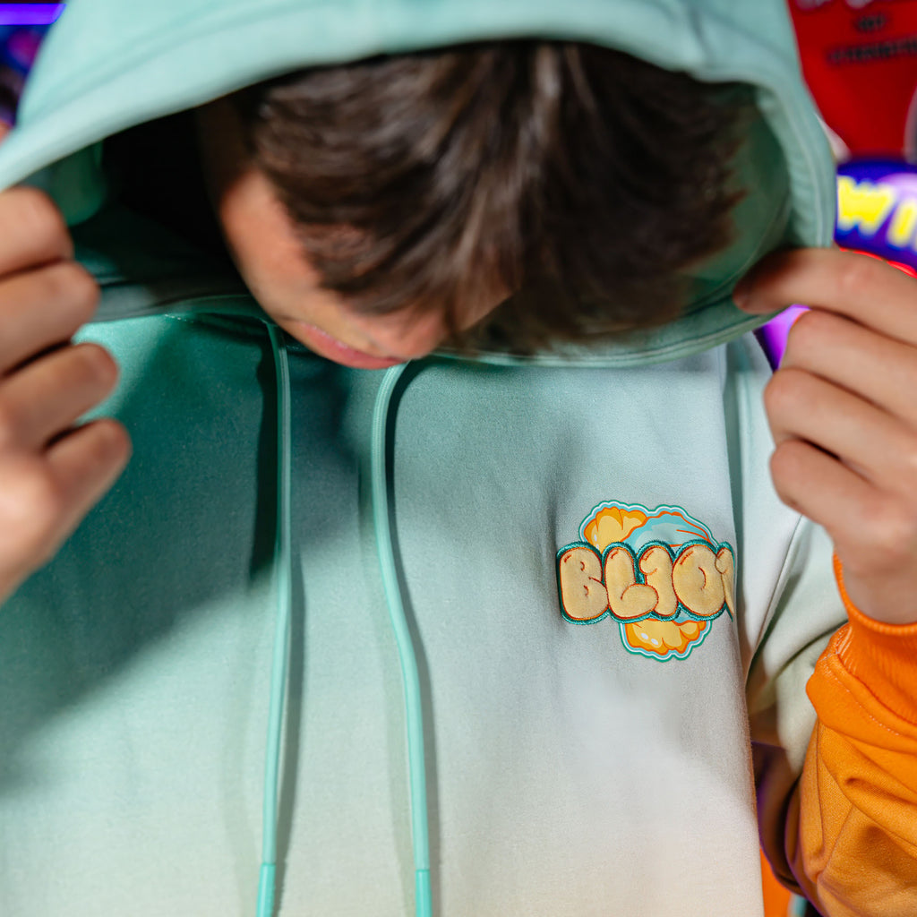 Adult model wearing Cotton Candy Tangerine Freeze hoodie