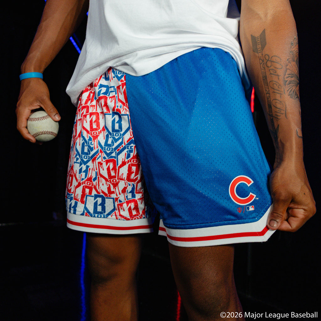 Adult model wearing blue shorts with "Chicago Cubs Sticker Court" design