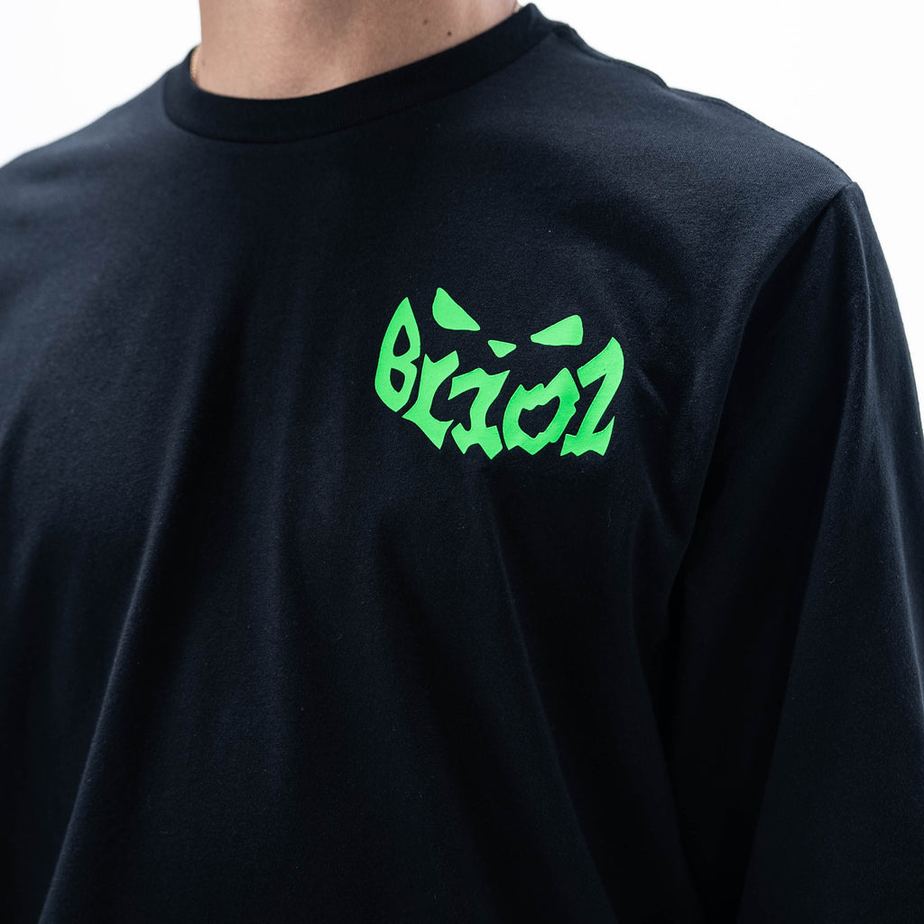 Adult model wearing black long sleeve tee with "Jack O' Lantern Team" design