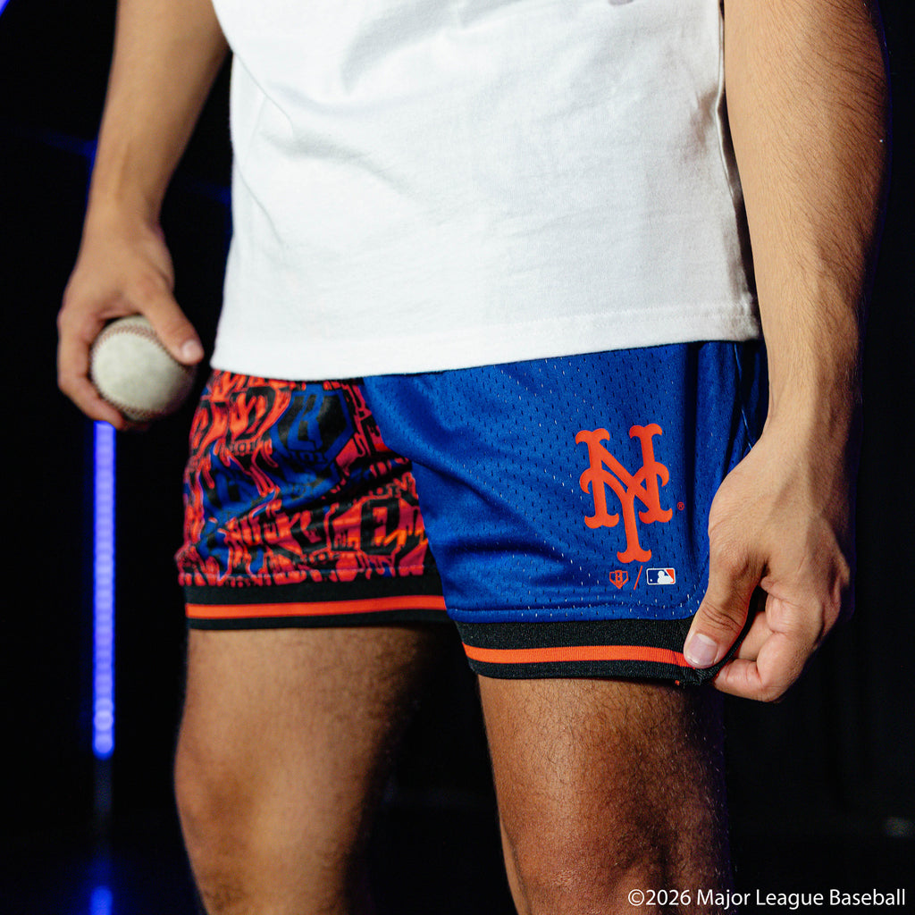 Adult model wearing blue shorts with "New York Mets Sticker Court" design
