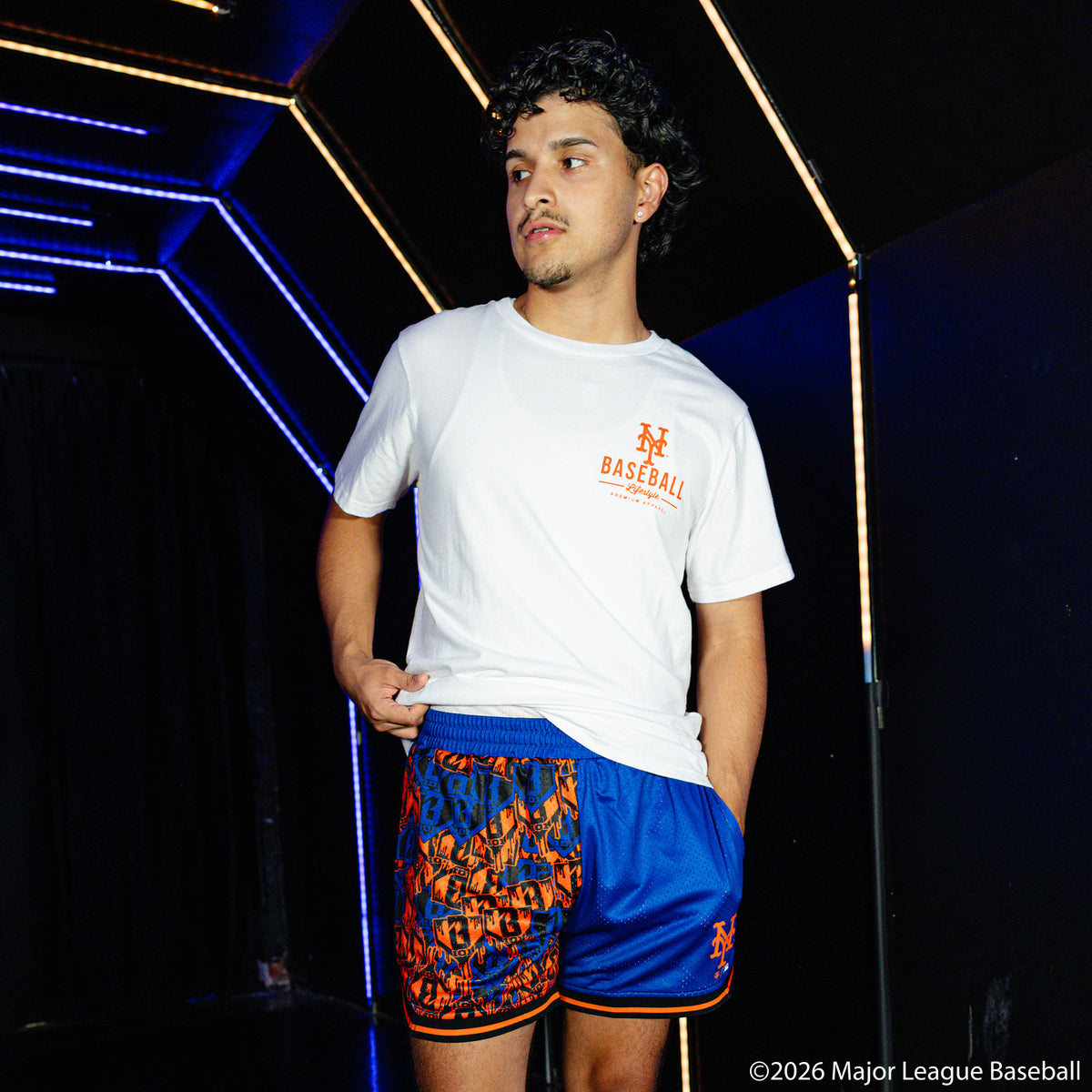 Adult model wearing white graphic tee with "New York Mets Ice Cream Cap" design