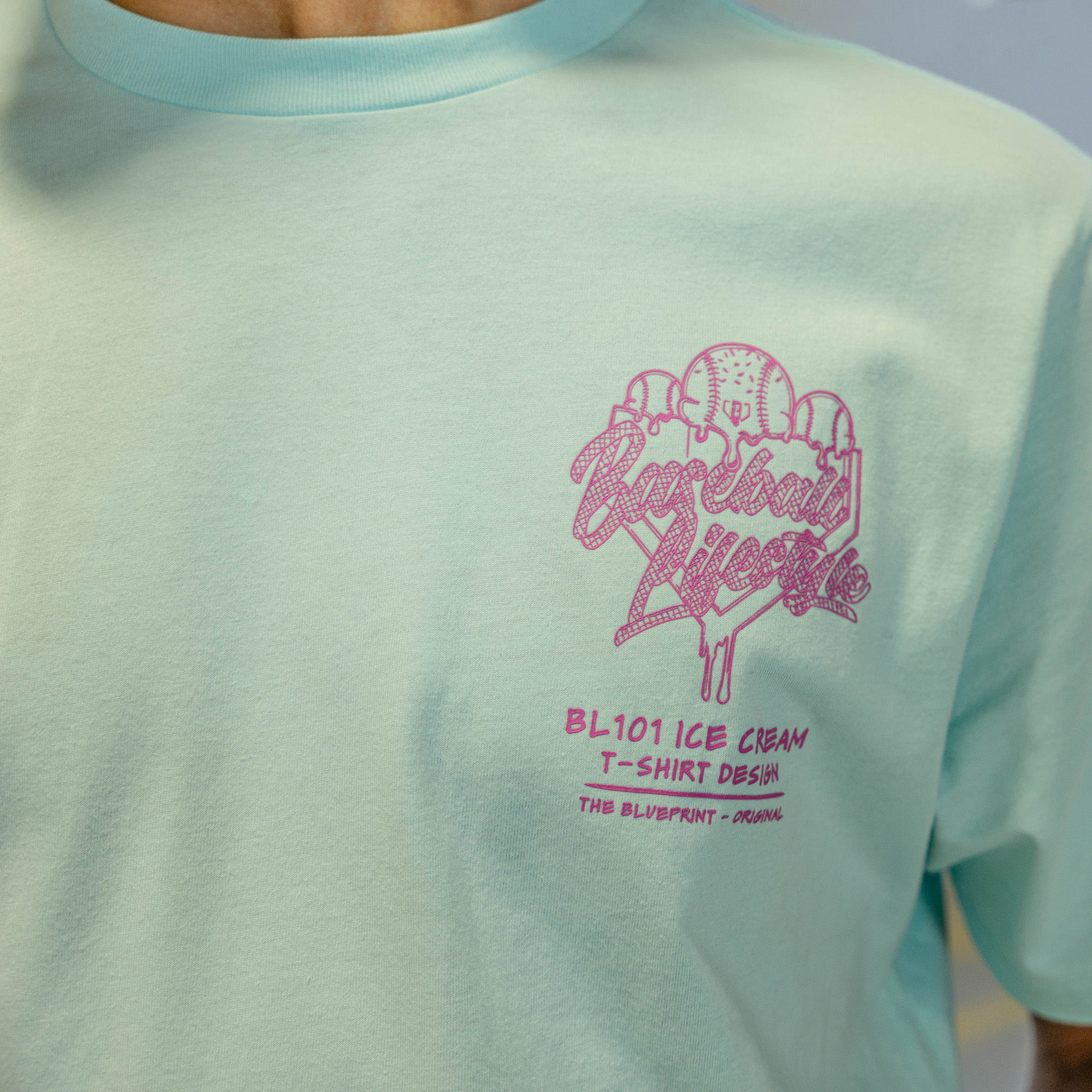 Light blue t-shirt with pink ice cream graphic and "Baseball Lifestyle 101" logo
