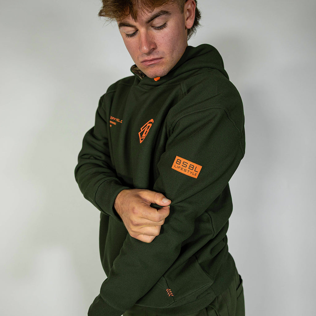 Adult model wearing green Realtree Legacy Off-Field Waffle Performance Camo hoodie