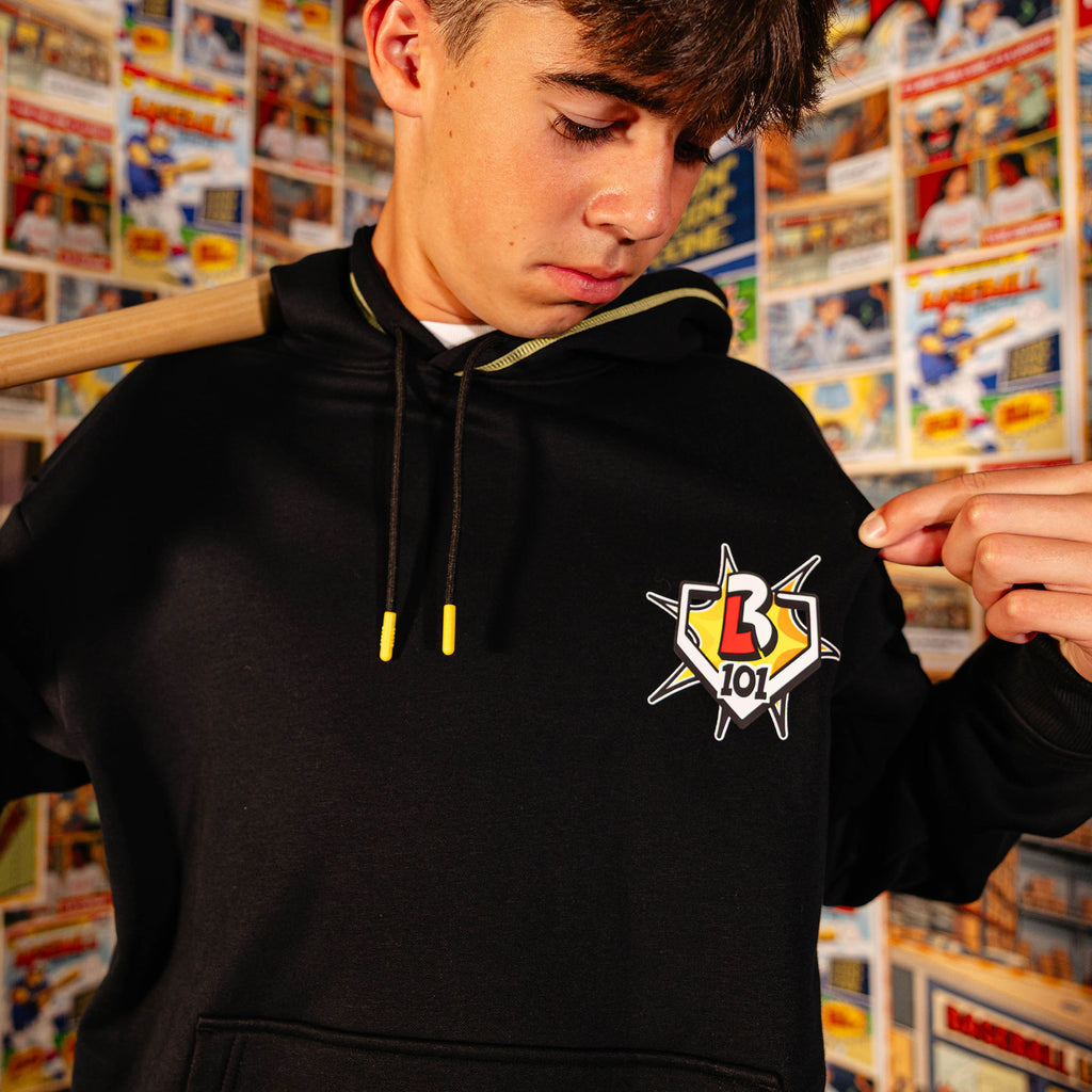Adult model wearing black hoodie with "Power Hitter" design