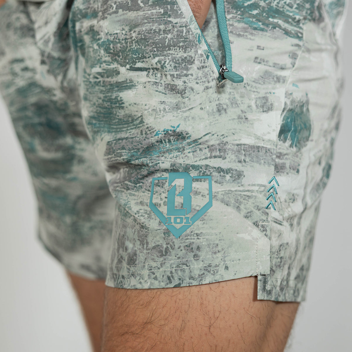 Adult model wearing gray Realtree Aspect Pro Series V2 Camo shorts with liner