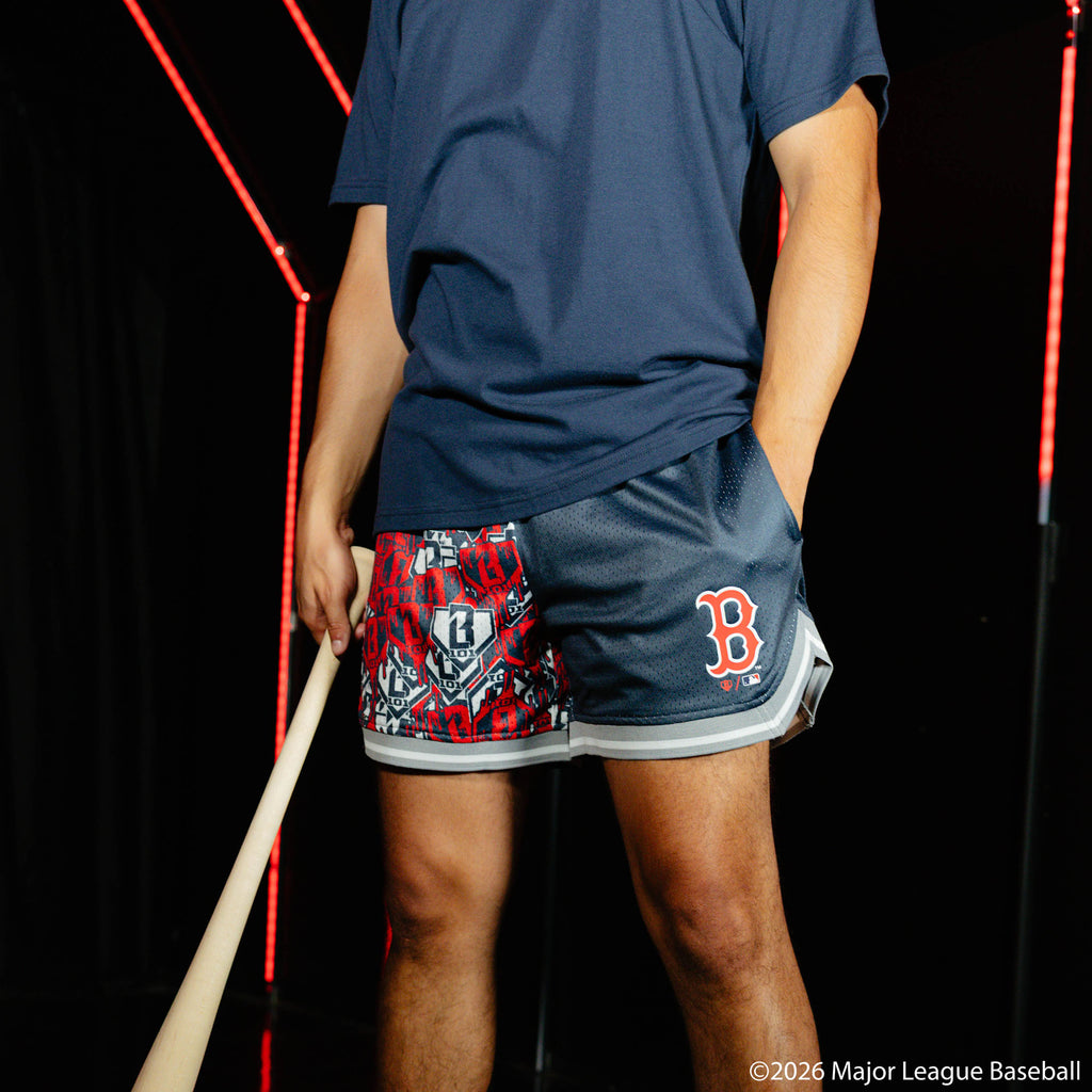 Adult model wearing navy shorts with "Boston Red Sox Sticker Court" design