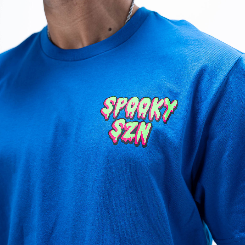 Adult model wearing blue graphic tee with "Spooky SZN Waffle" design