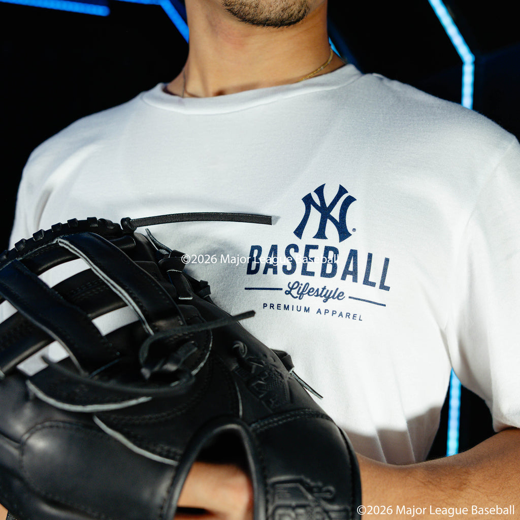Adult model wearing white graphic tee with "New York Yankees Ice Cream" design