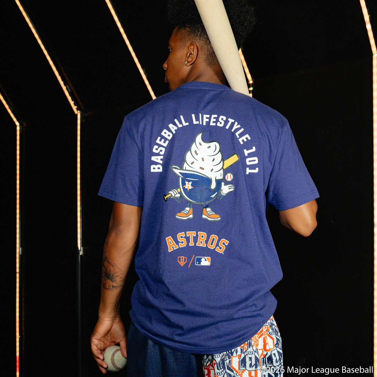 Adult model wearing navy graphic tee with "Houston Astros Ice Cream" design