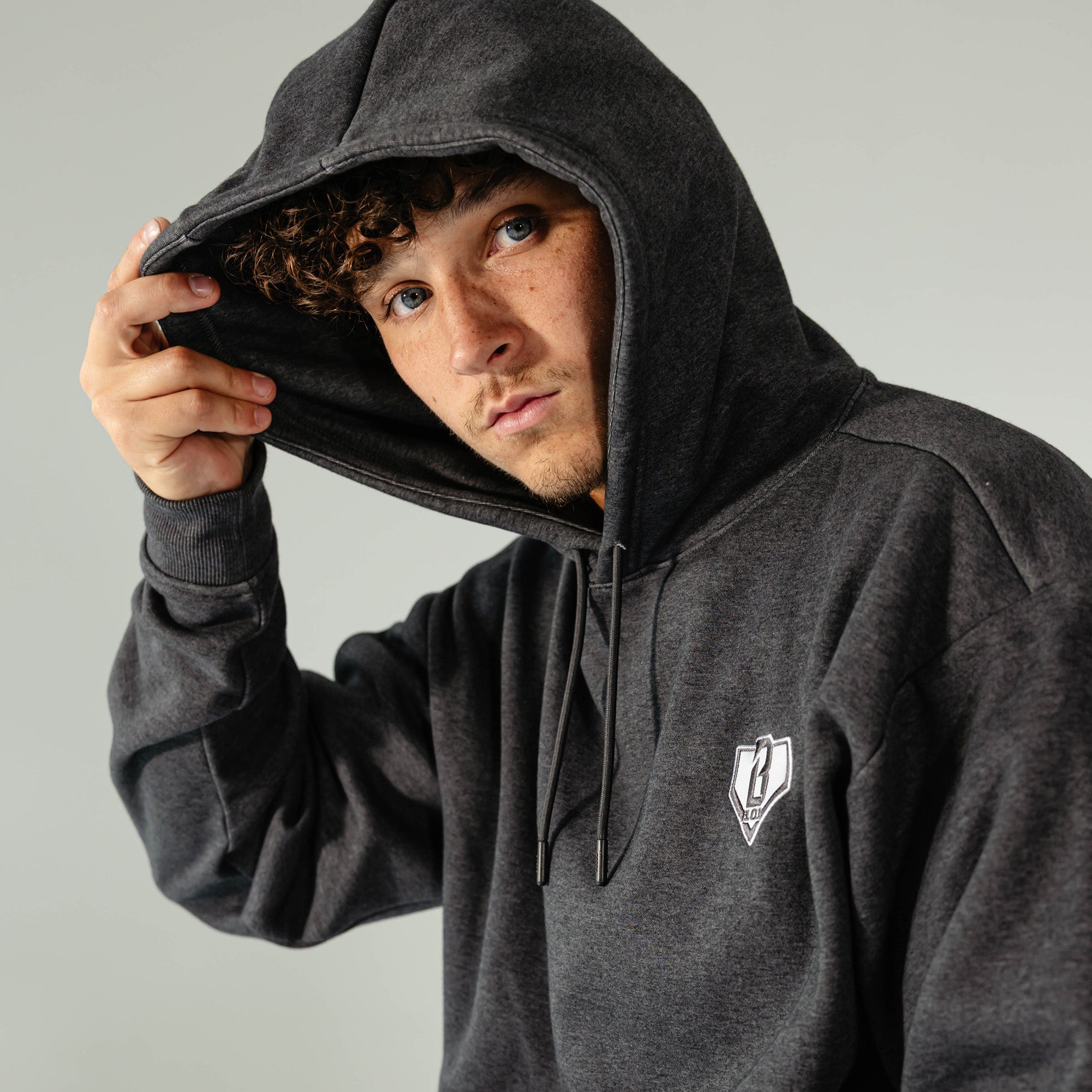 Adult model wearing Gray Baseline hoodie