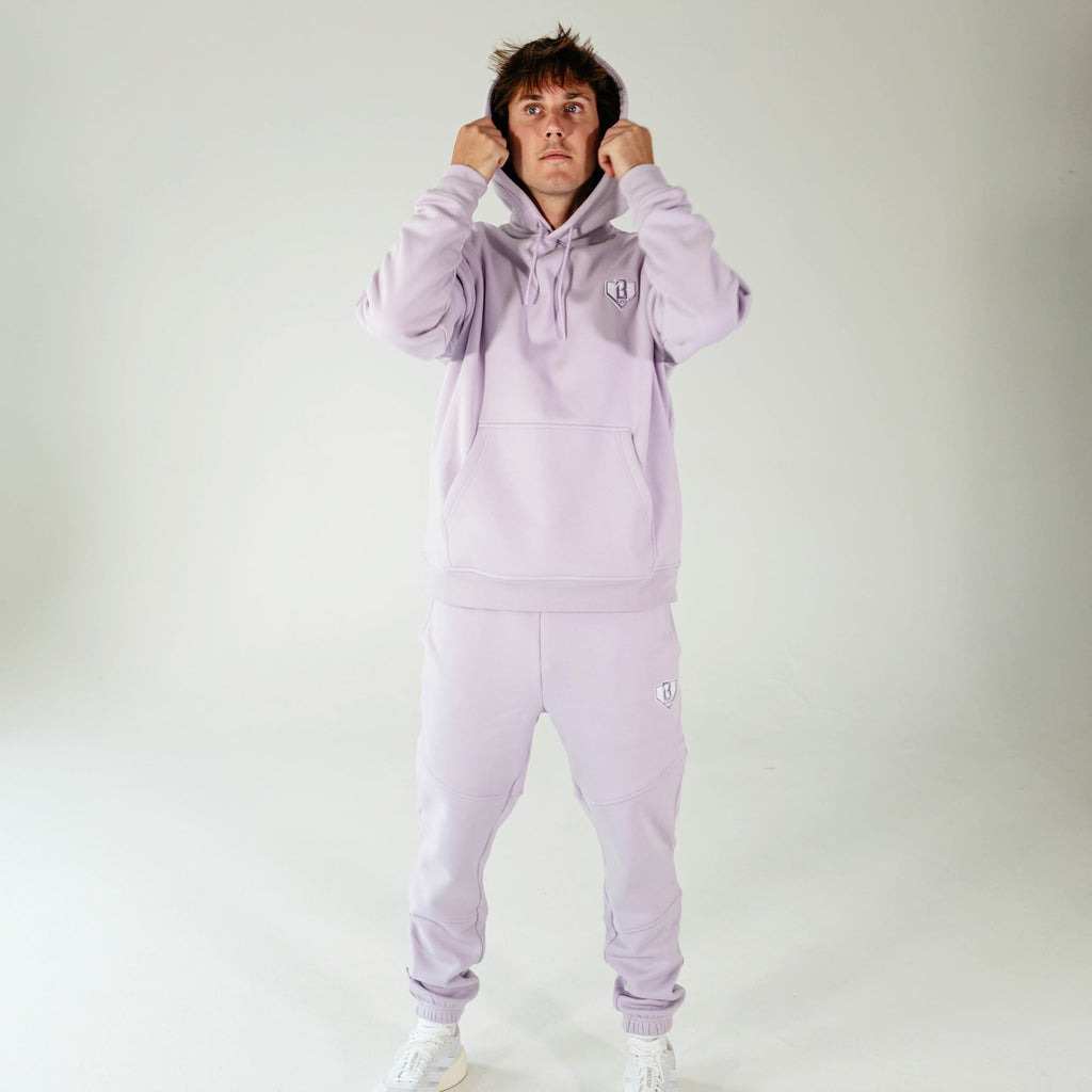 Adult model wearing Purple Baseline hoodie