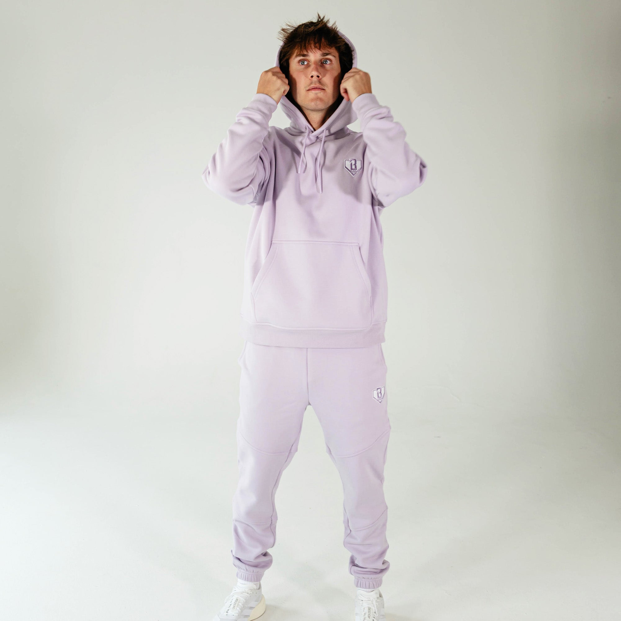 Adult model wearing Purple Baseline hoodie