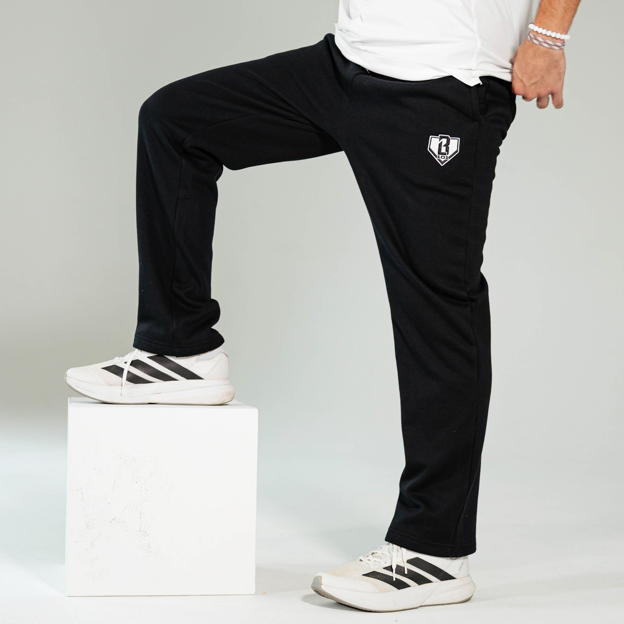 Adult model wearing Black Baseline Straight Leg sweatpants
