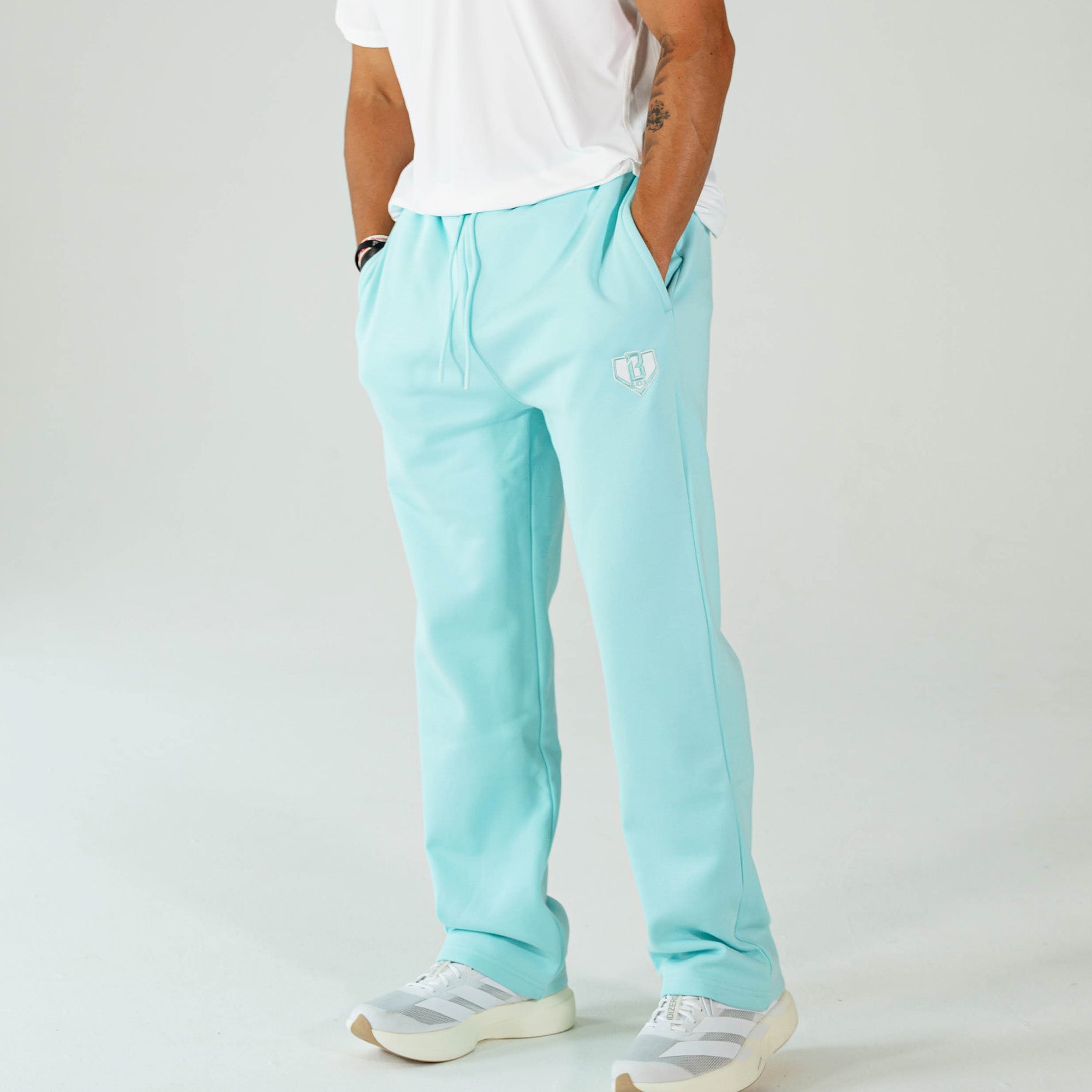 Adult model wearing Blue Baseline Straight Leg sweatpants