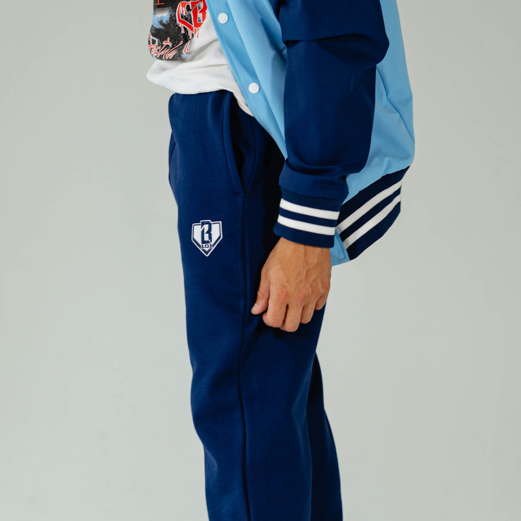 Adult model wearing Navy Baseline Straight Leg sweatpants