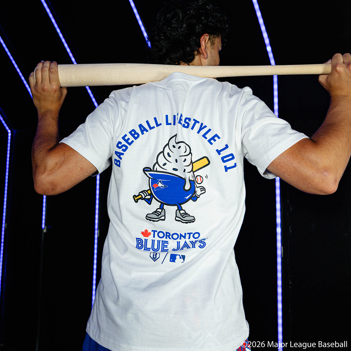 Adult model wearing white graphic tee with "Toronto Blue Jays Ice Cream" design