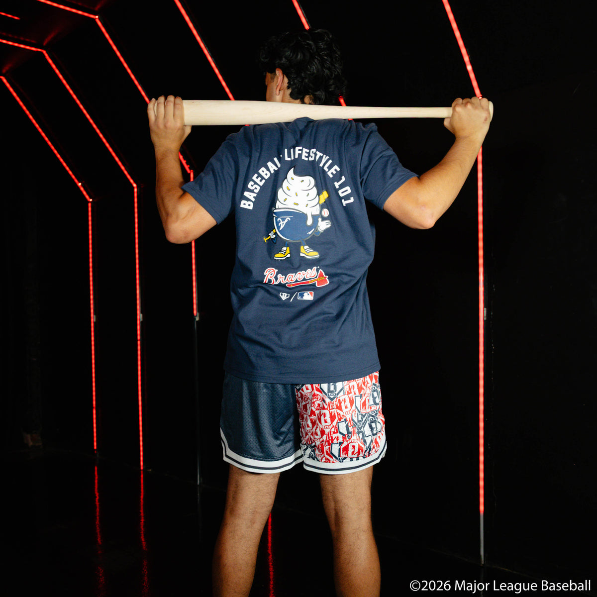 Adult model wearing navy graphic tee with "Atlanta Braves Ice Cream" design