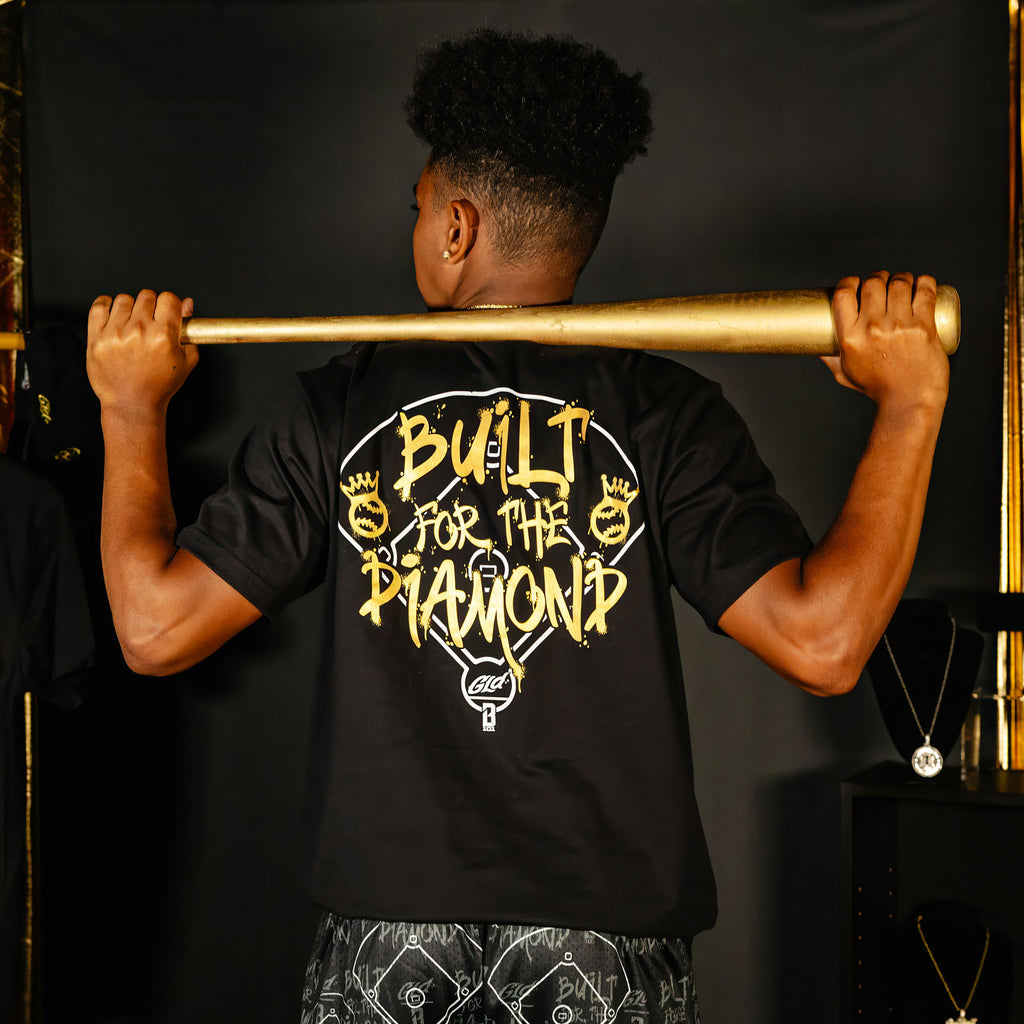 Adult model wearing black graphic tee with "Built For The Diamond" design