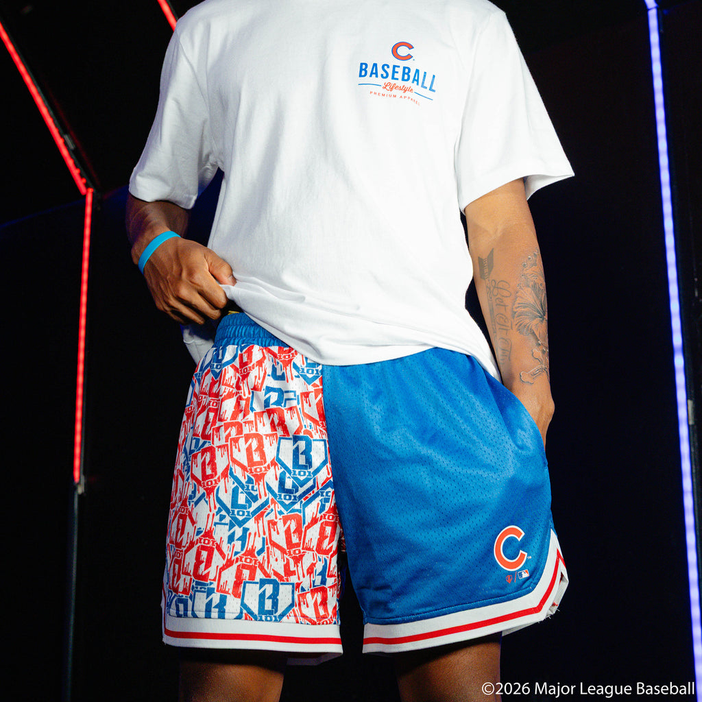 Adult model wearing blue shorts with "Chicago Cubs Sticker Court" design