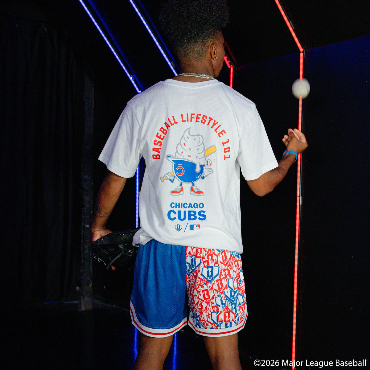 Adult model wearing white graphic tee with "Chicago Cubs Ice Cream" design