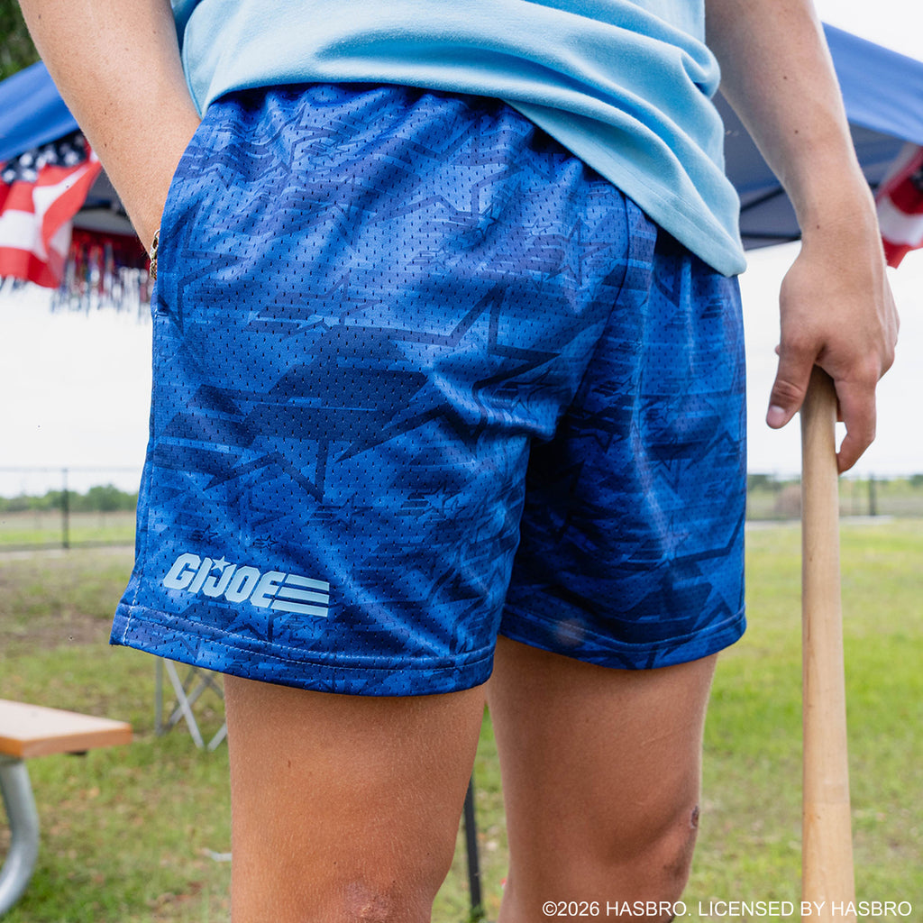 Adult model wearing blue shorts with “G.I. Joe Star” design