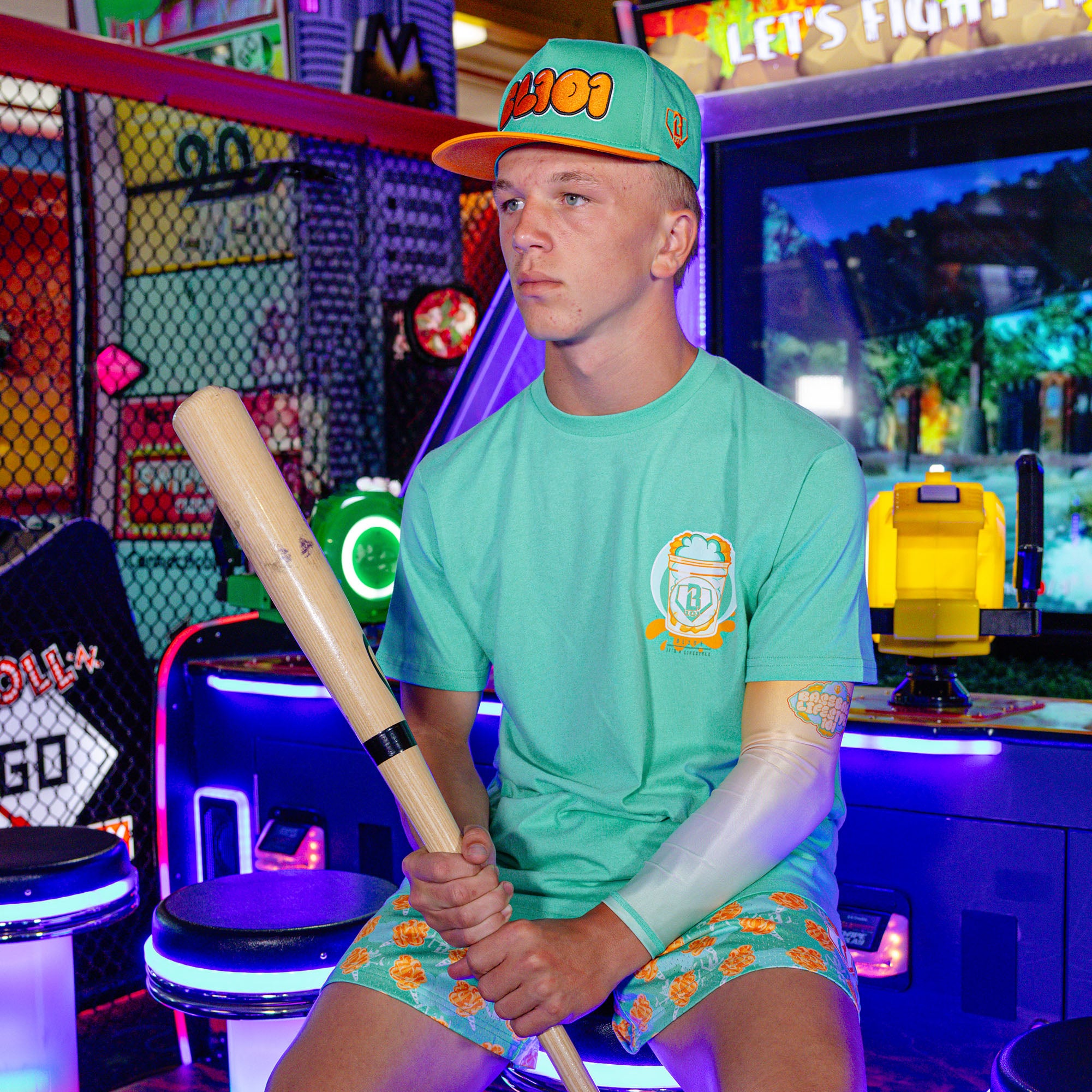 Adult model wearing Home Run Sugar Tangerine Freeze shorts