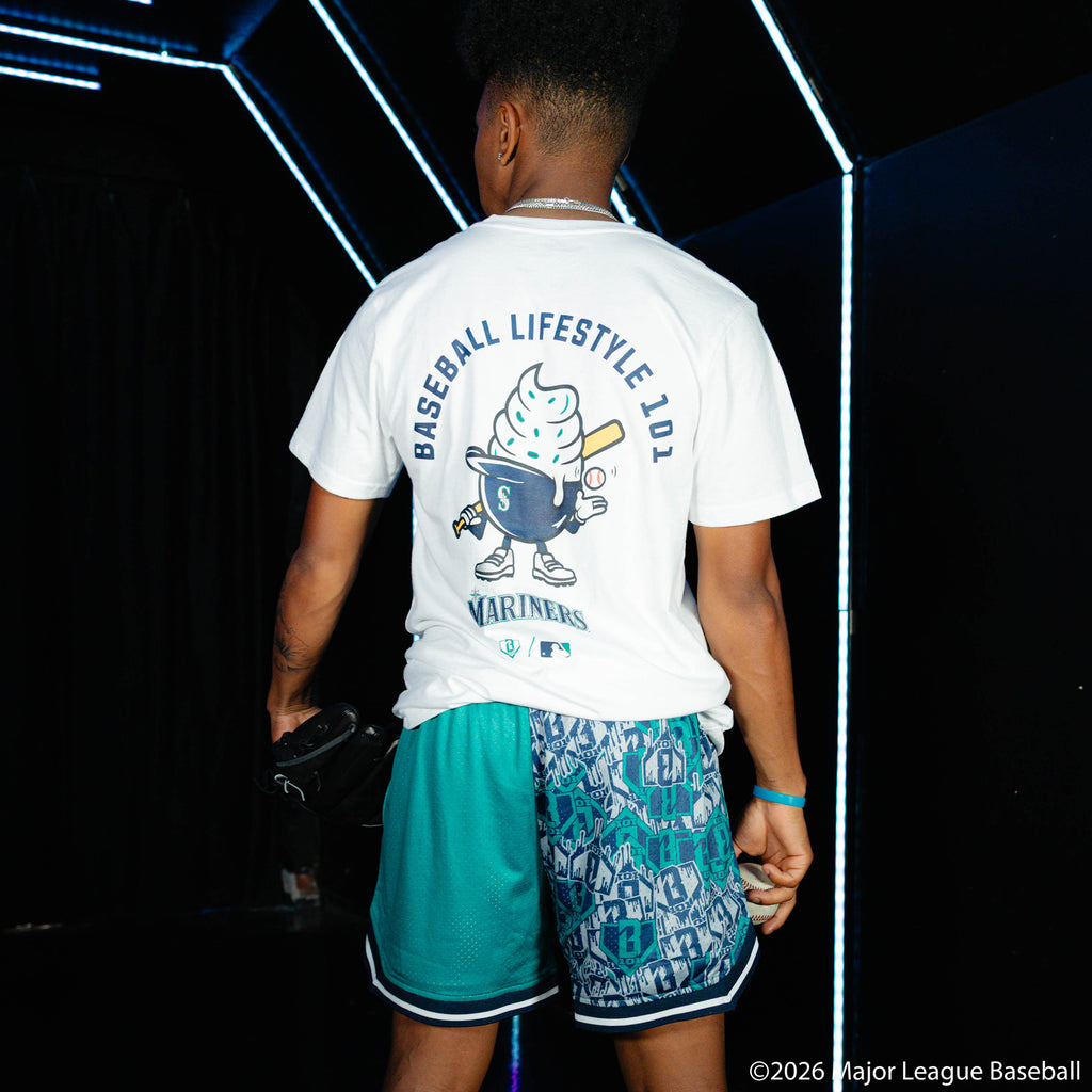 Adult model wearing white graphic tee with "Seattle Mariners Ice Cream Cap" design
