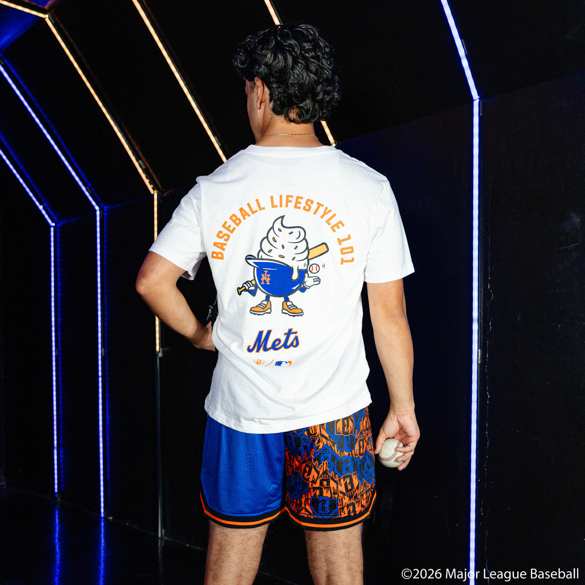 Adult model wearing white graphic tee with "New York Mets Ice Cream Cap" design