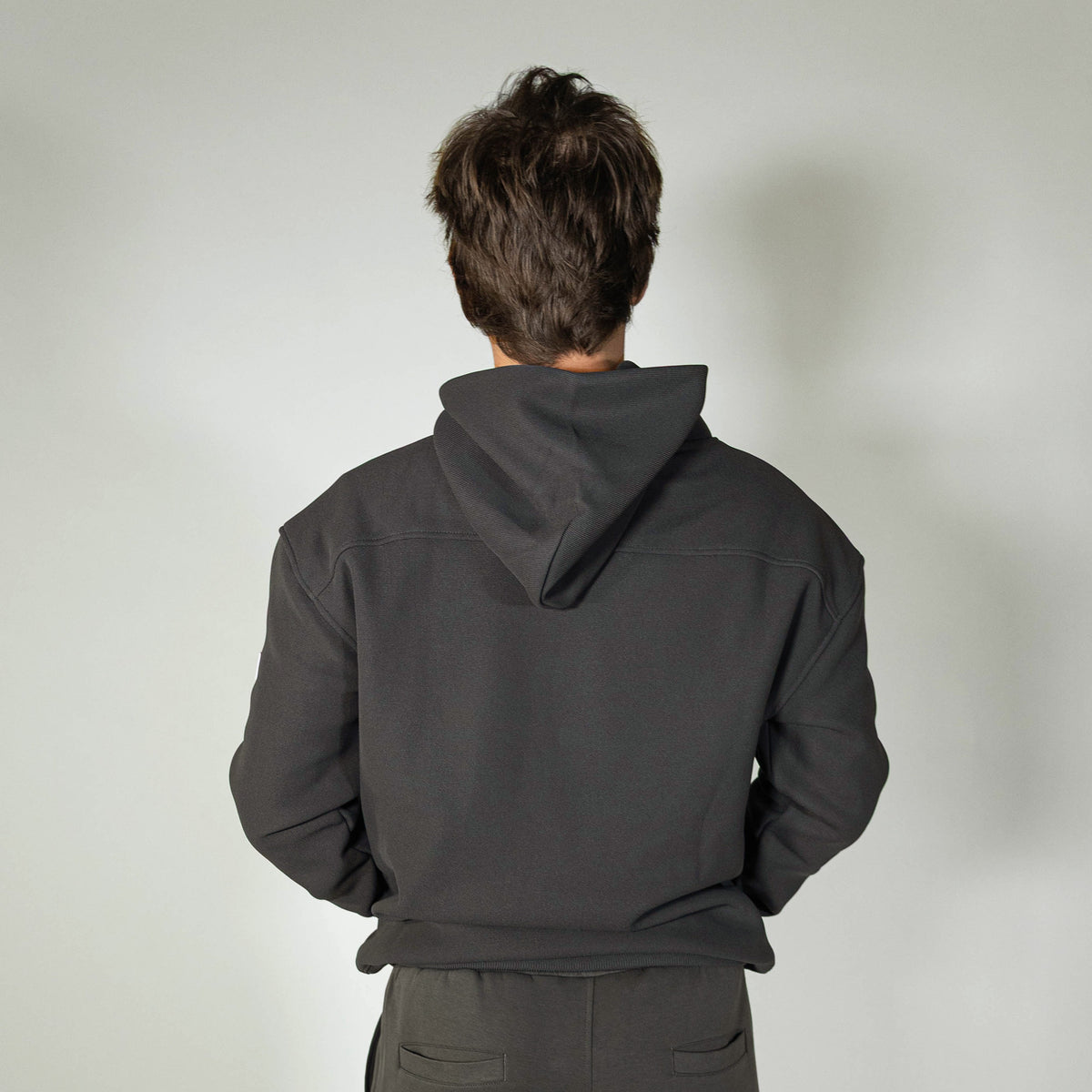 Adult model wearing gray and lilac Off-Field Waffle Performance hoodie