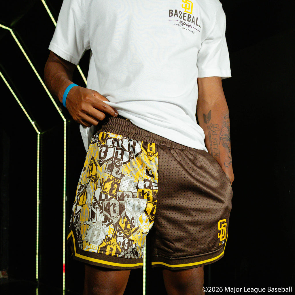 Adult model wearing shorts with "San Diego Padres Sticker Court" design