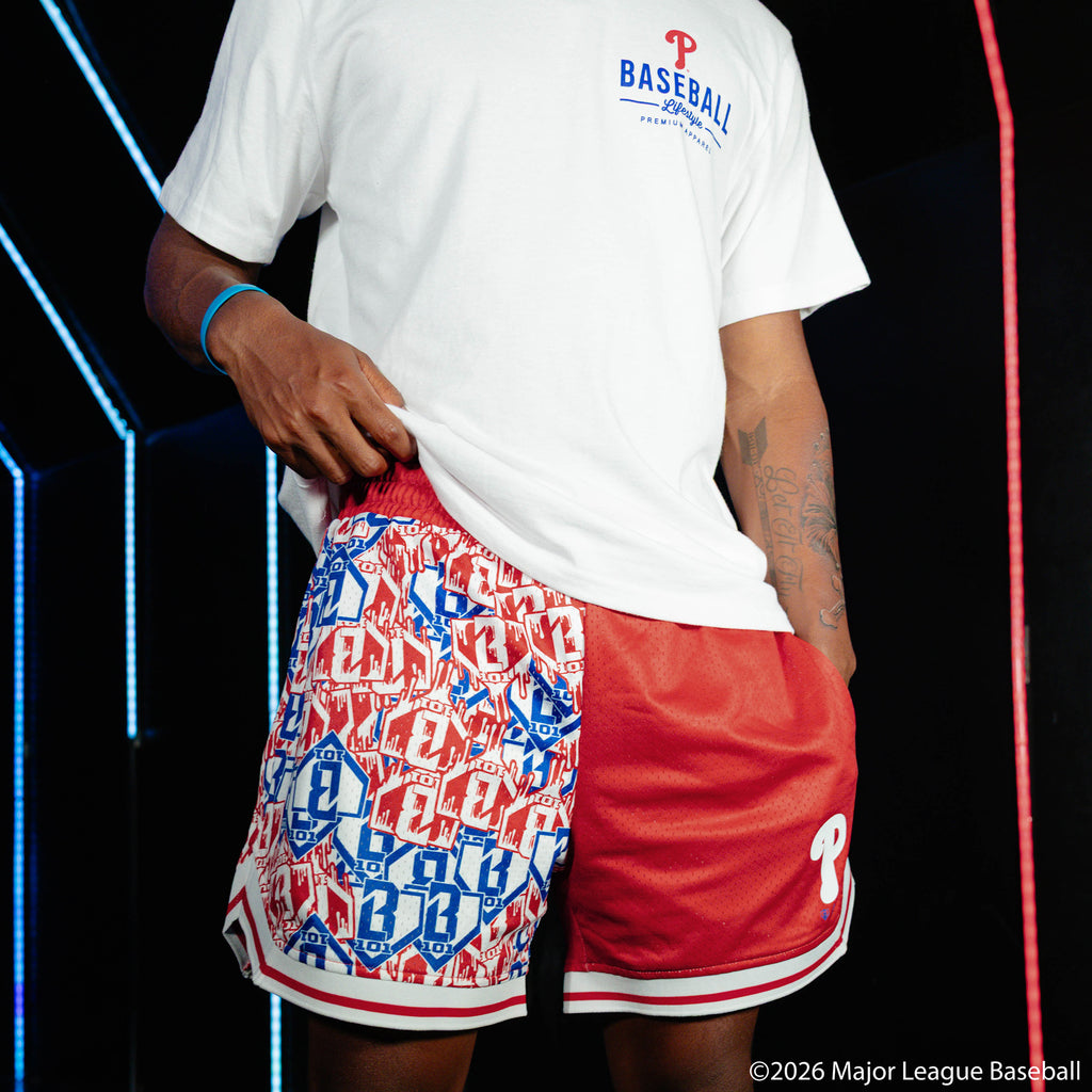 Adult model wearing red shorts with "Philadelphia Phillies Sticker Court" design