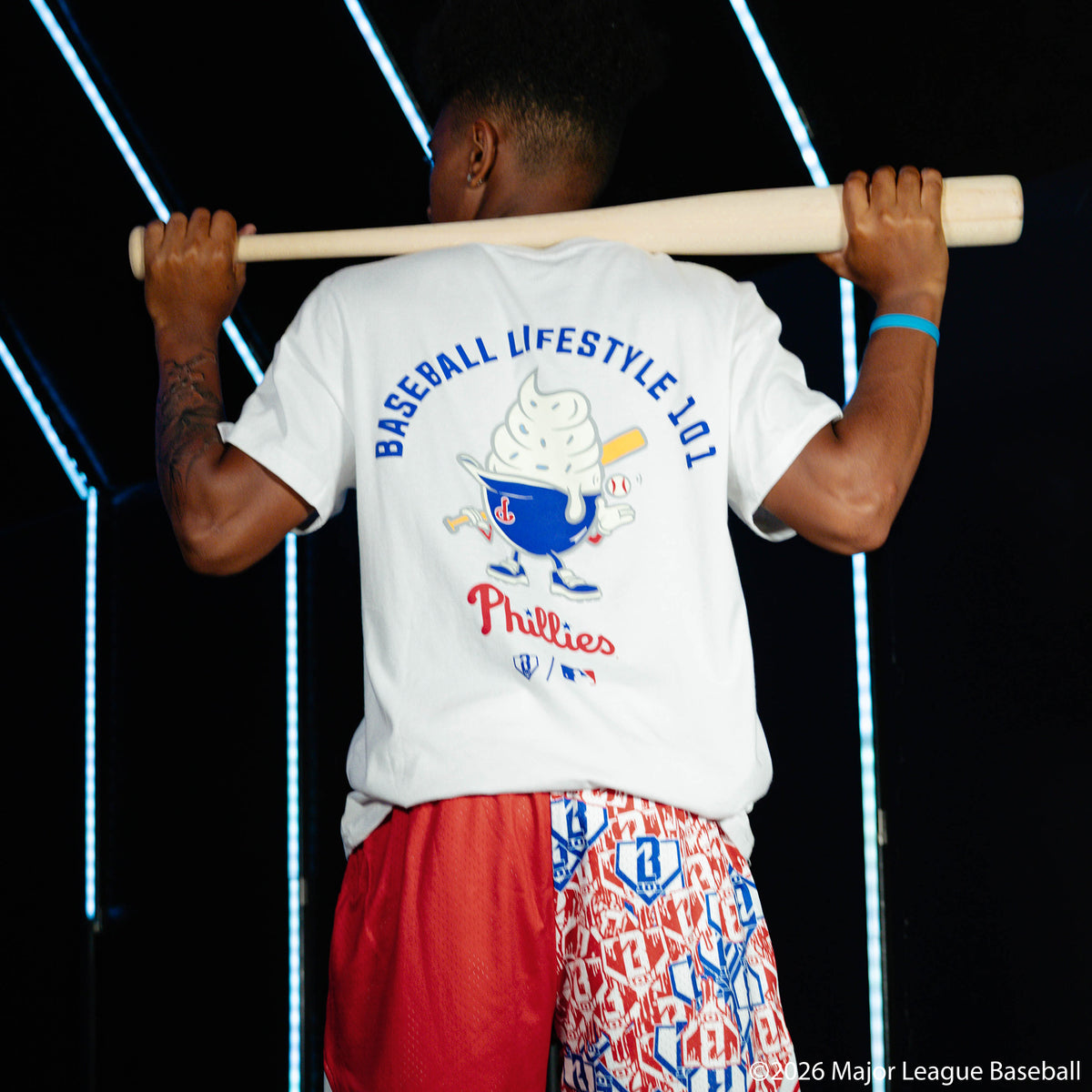 Adult model wearing white graphic tee with "Philadelphia Phillies Ice Cream Cap" design