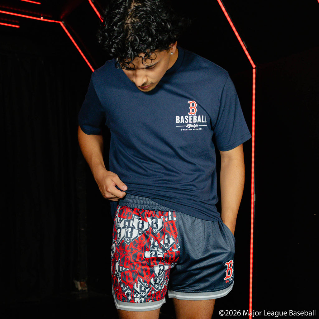 Adult model wearing navy shorts with "Boston Red Sox Sticker Court" design