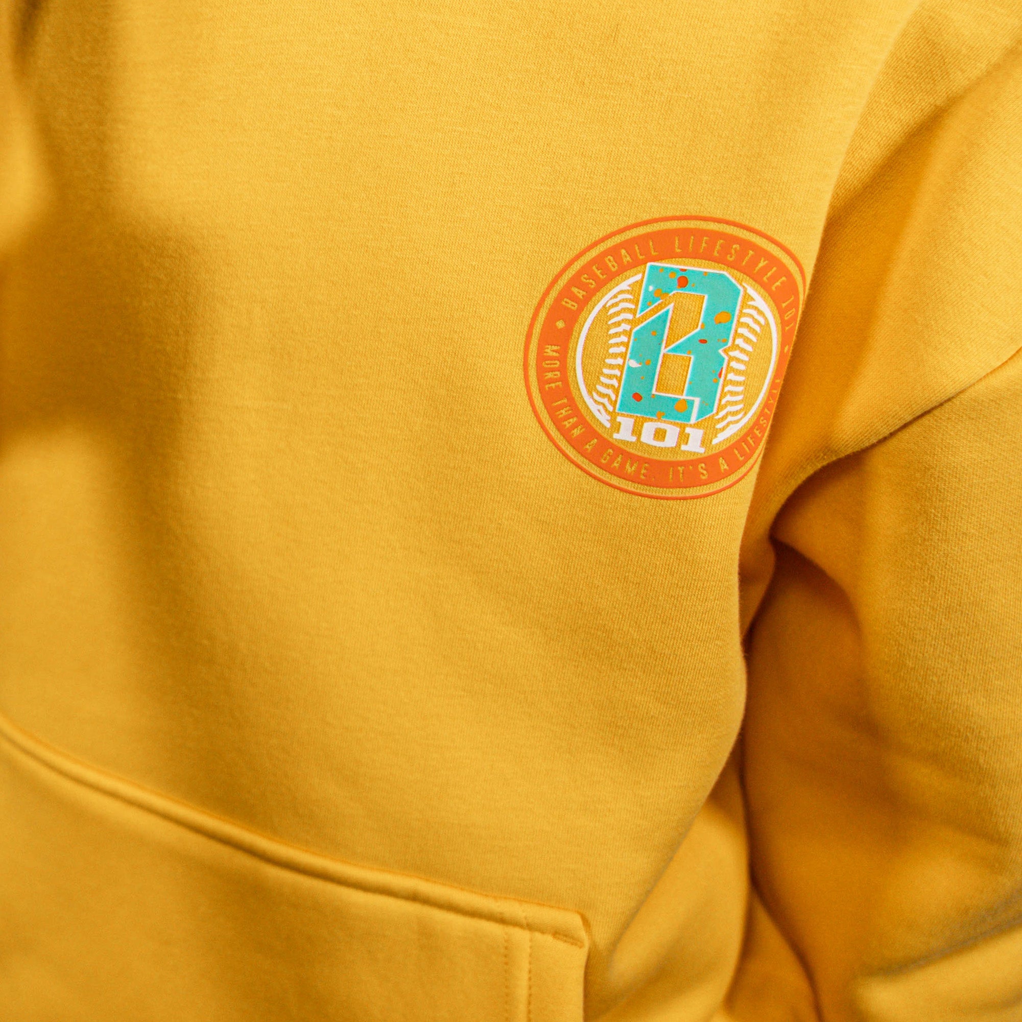 Orange hoodie with a small BL101 logo on the chest area