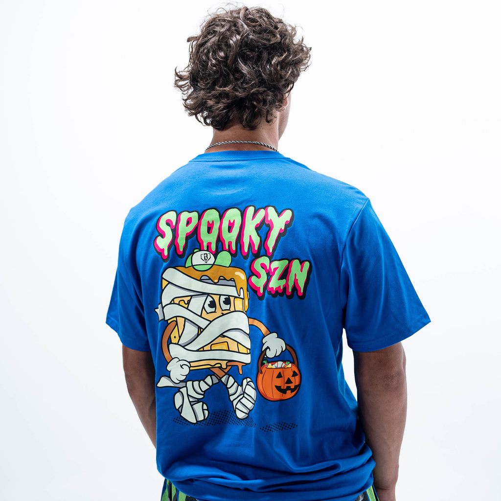 Adult model wearing blue graphic tee with "Spooky SZN Waffle" design