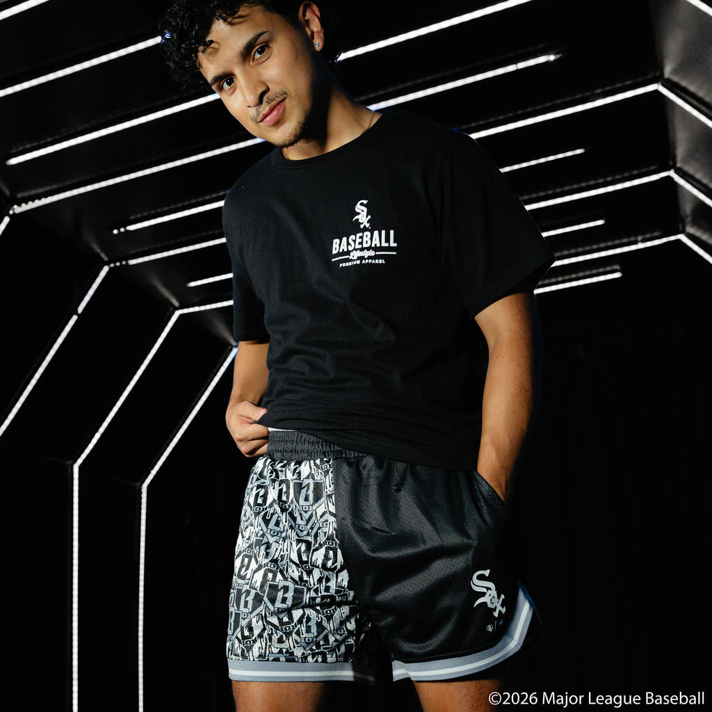 Adult model wearing black shorts with "Chicago White Sox Sticker Court" design