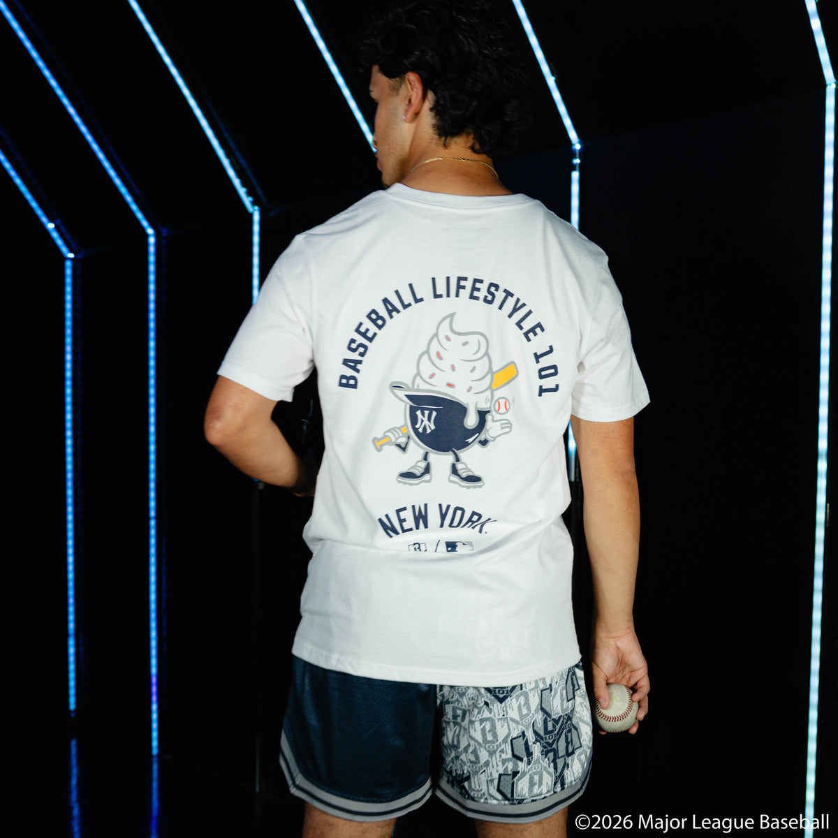 Adult model wearing white graphic tee with "New York Yankees Ice Cream" design