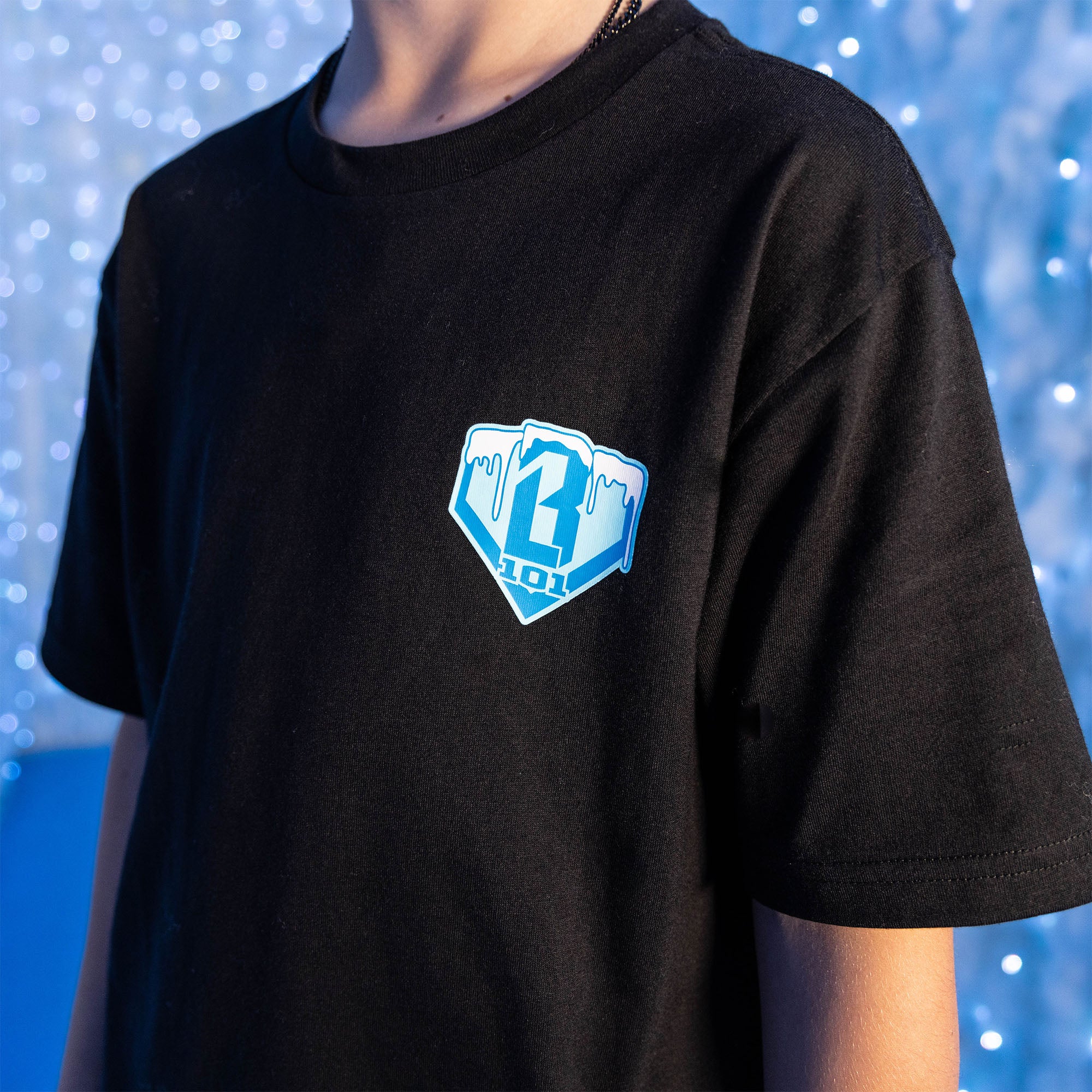 Adult model wearing graphic tee with “Snowball SZN” design