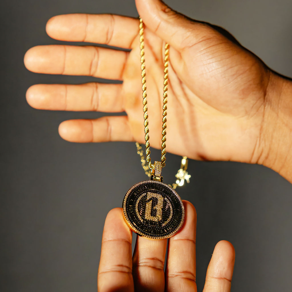 Model holding Yellow Gold BL101 Medallion necklace