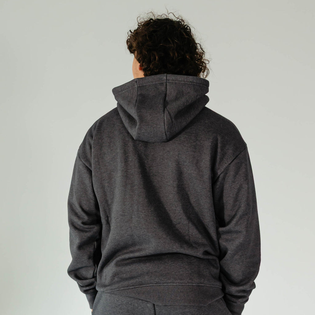 Adult model wearing Gray Baseline hoodie