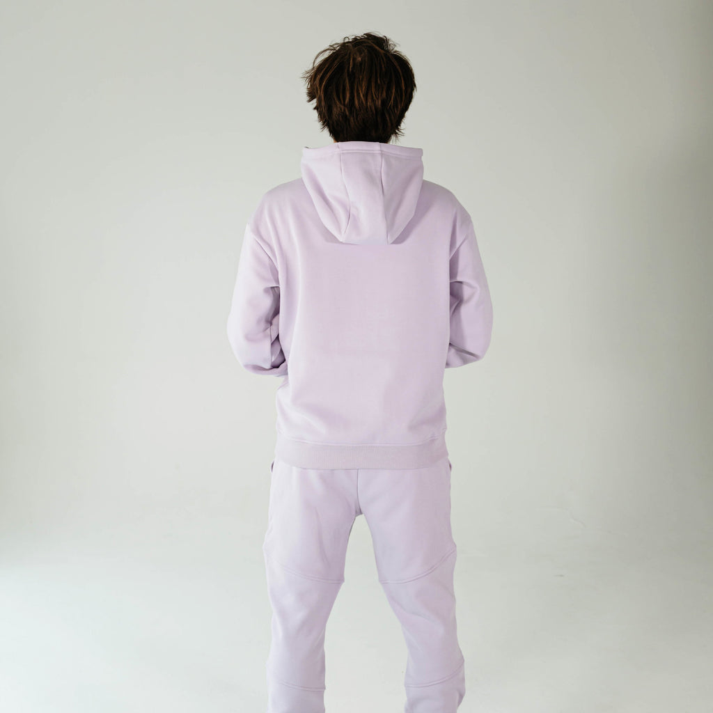 Adult model wearing Purple Baseline hoodie
