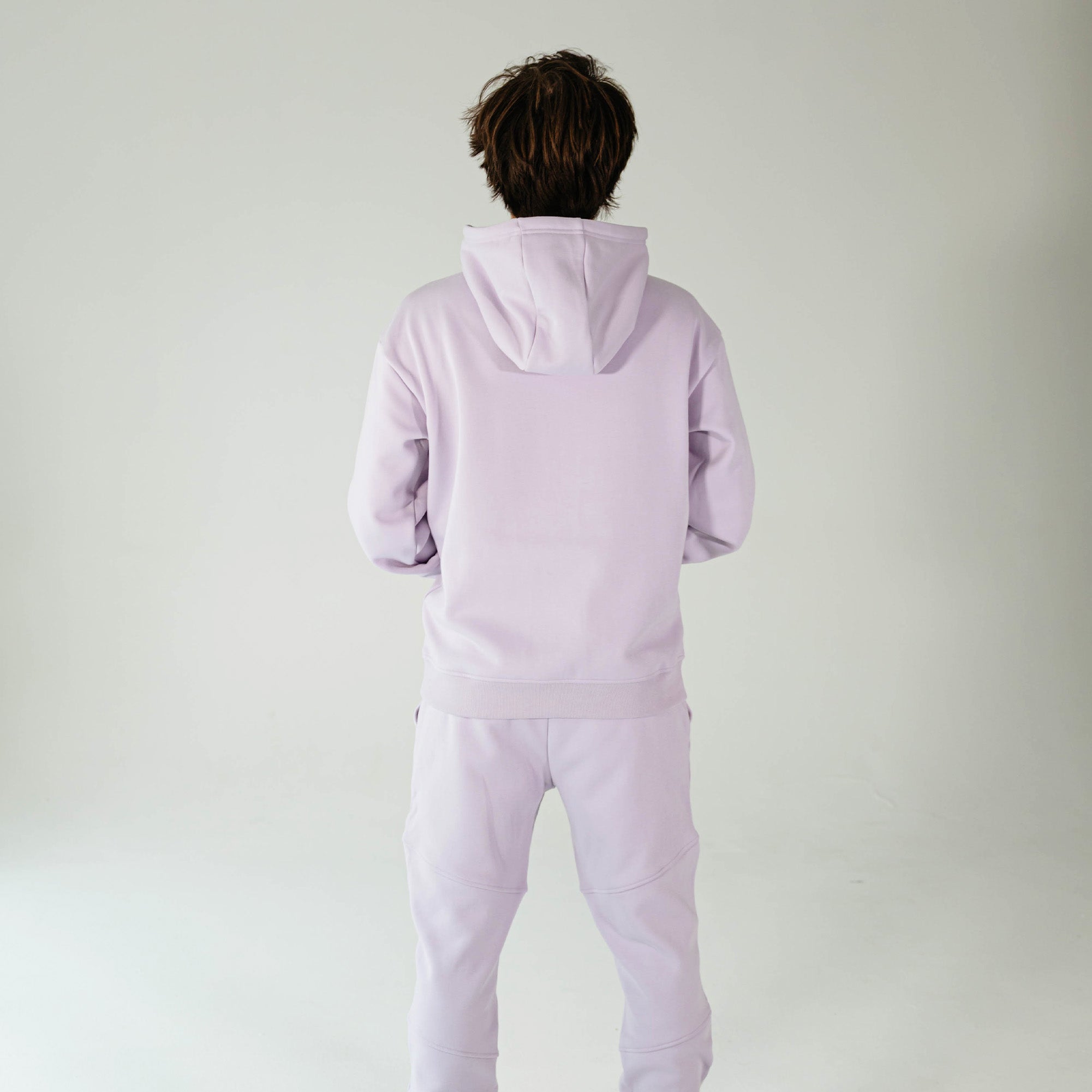 Adult model wearing Purple Baseline hoodie