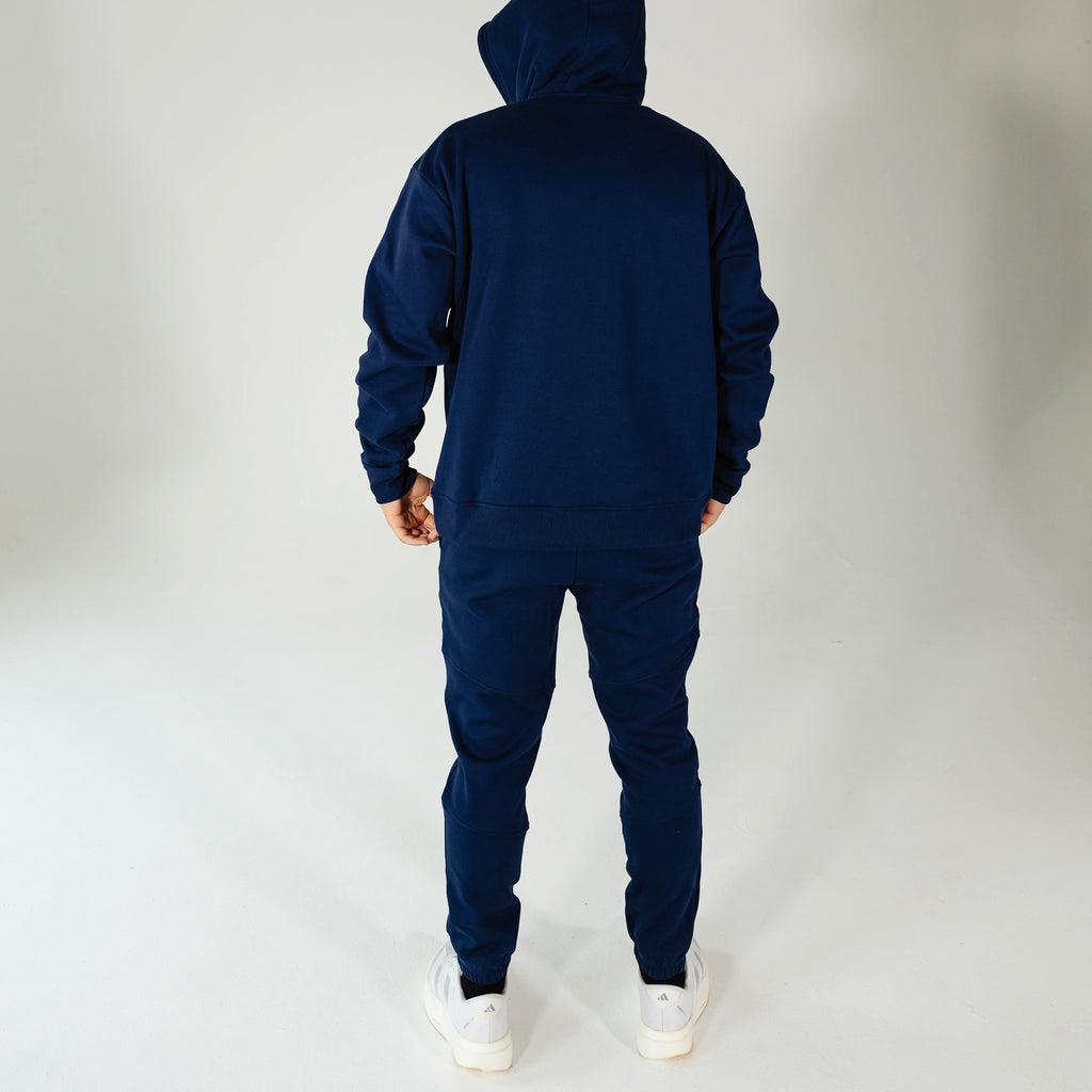 Adult model wearing Navy Baseline joggers