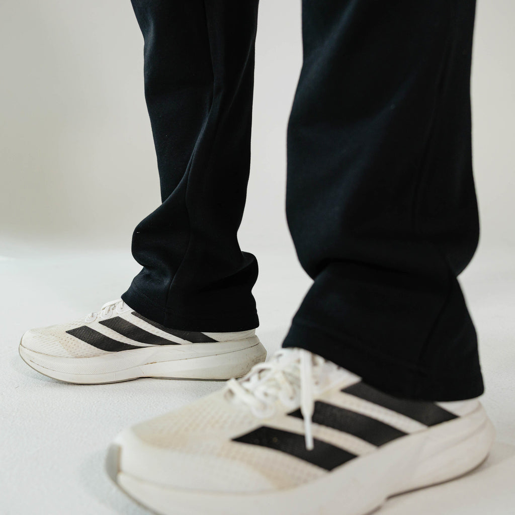Adult model wearing Black Baseline Straight Leg sweatpants