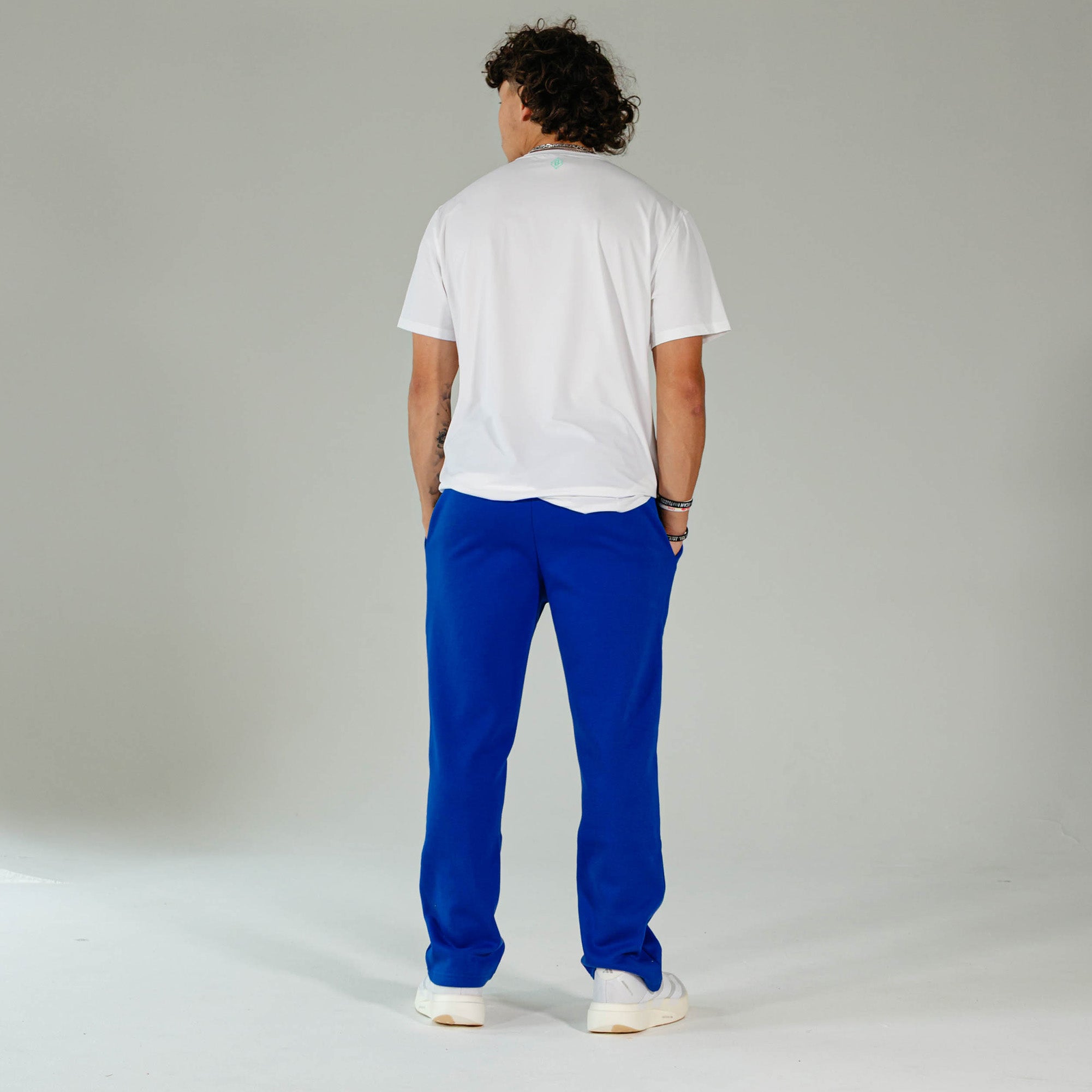 Adult model wearing Blue Baseline Straight Leg sweatpants
