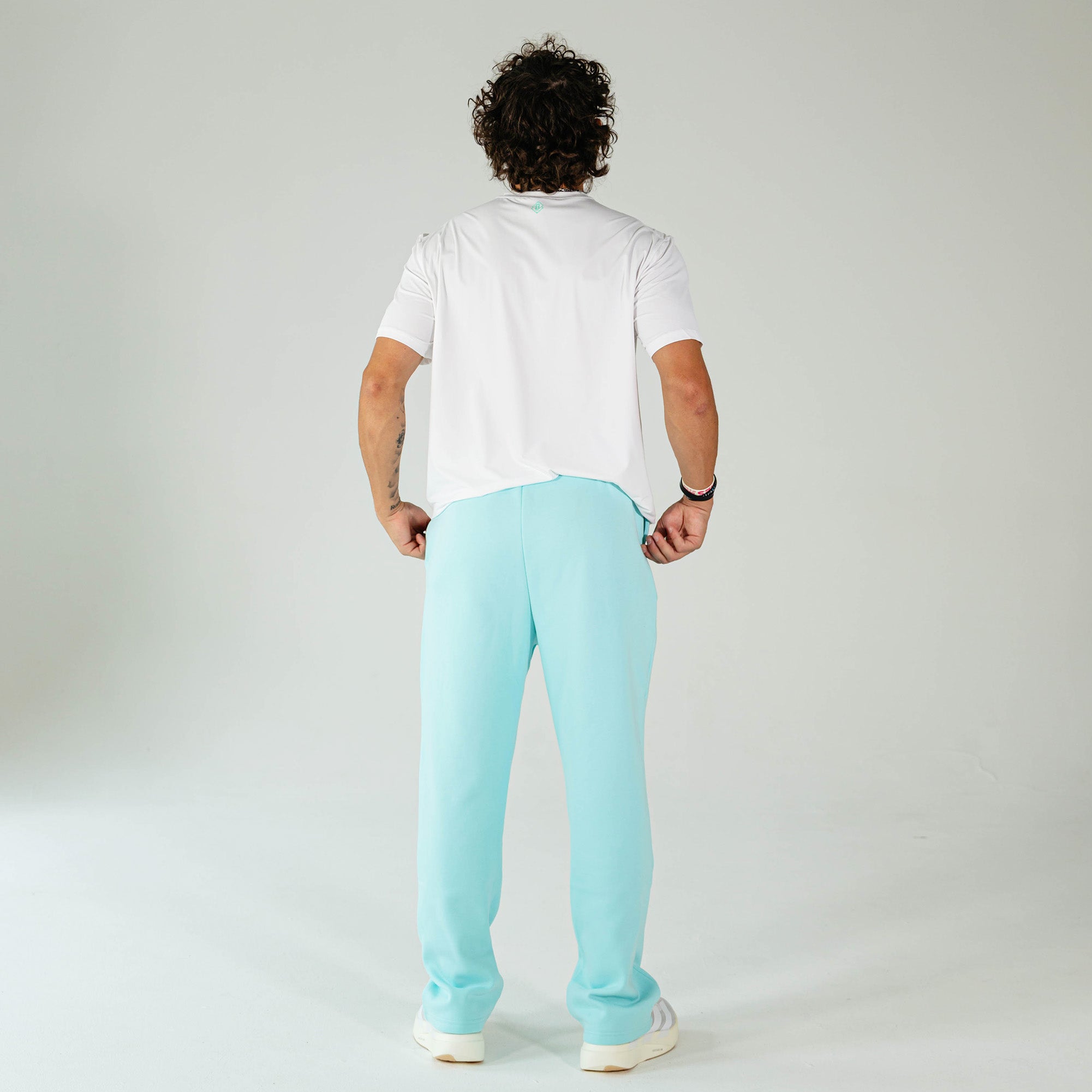 Adult model wearing Blue Baseline Straight Leg sweatpants