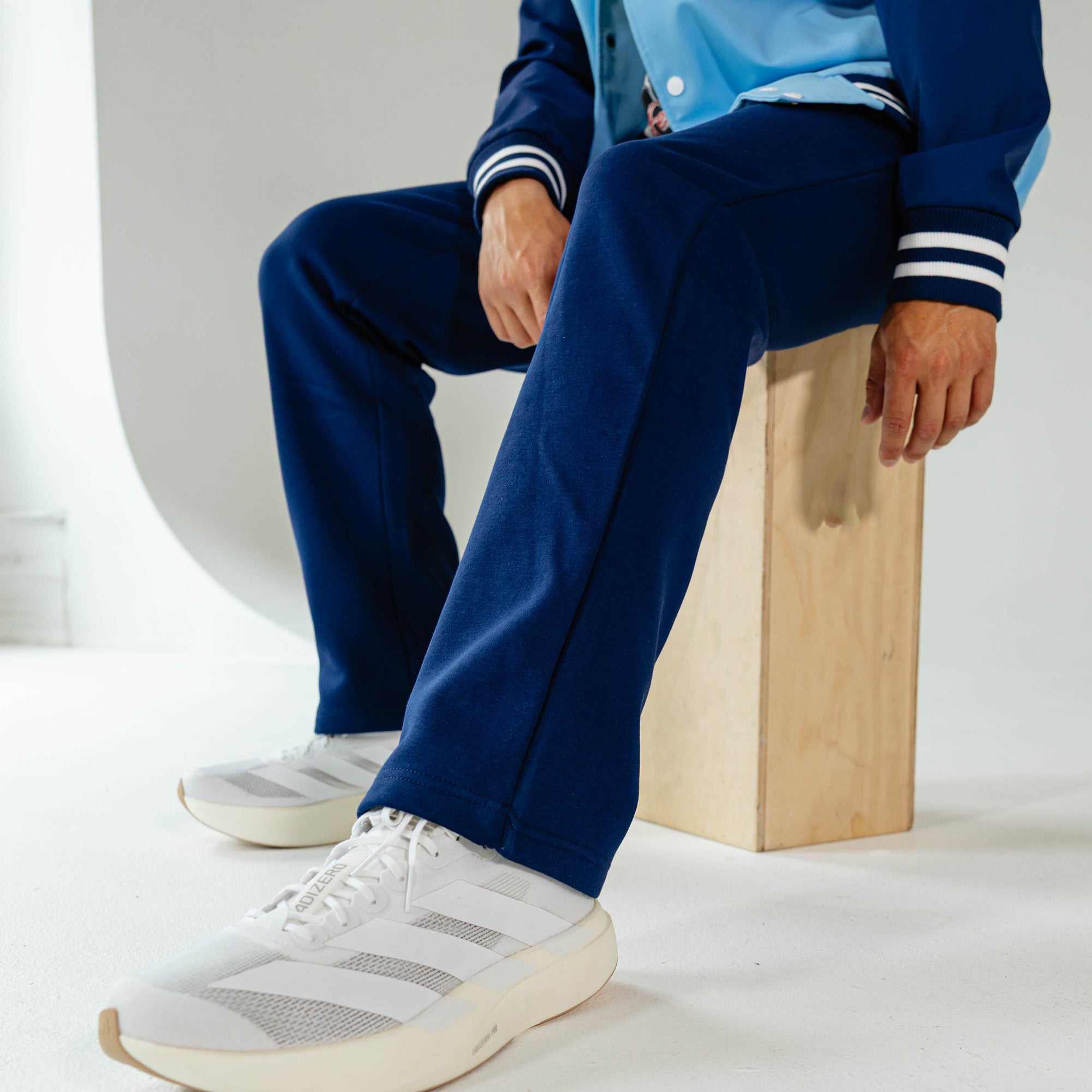 Adult model wearing Navy Baseline Straight Leg sweatpants